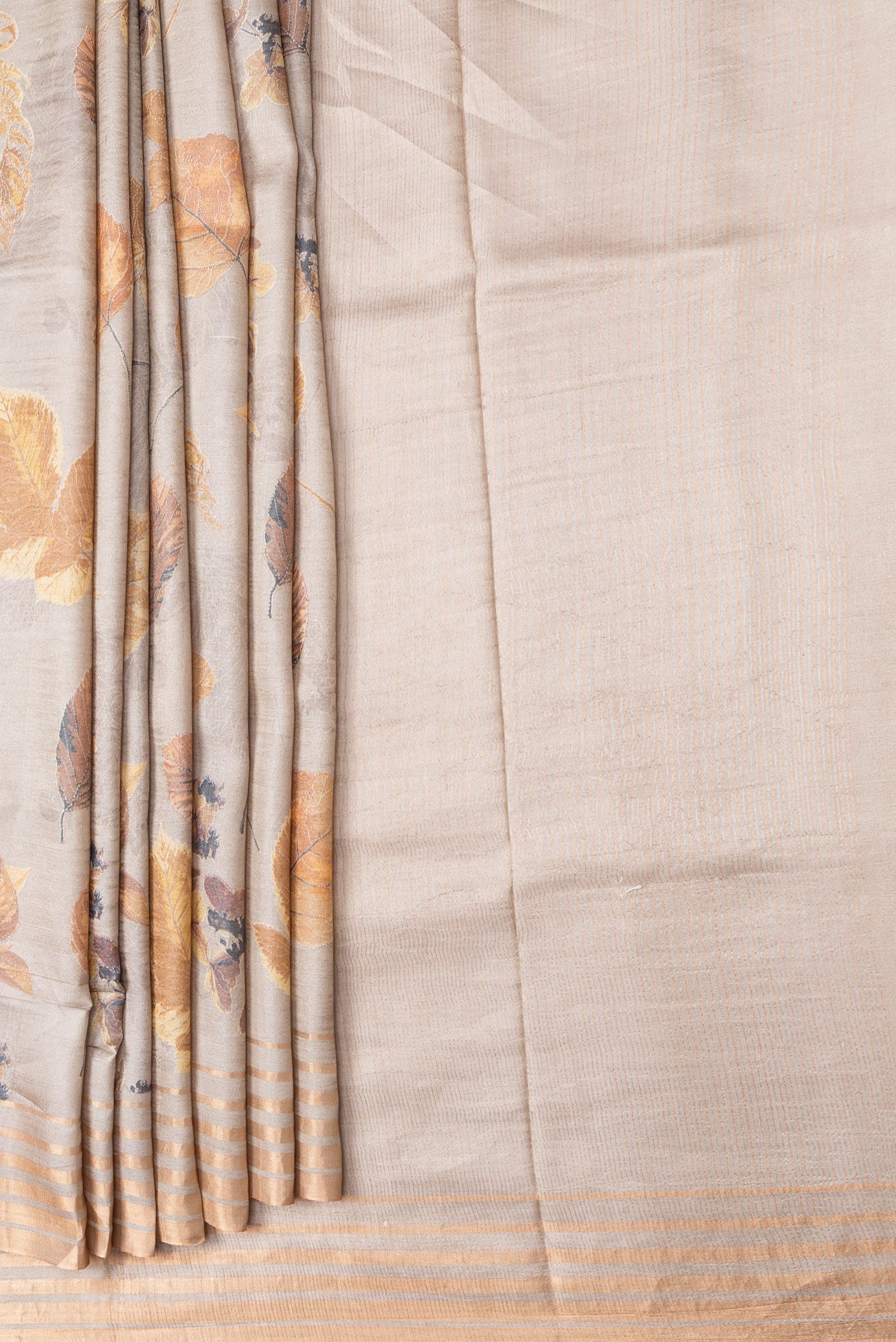 Pleats and pallu of Beige Dual Tone Tussar Silk Saree with Printed design on the body and Zari Border. 