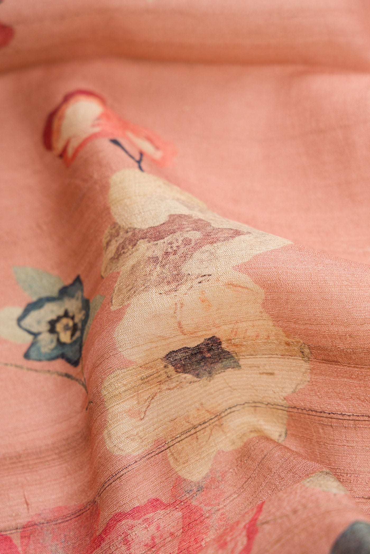 Close up of Rose pink Dual Tone Tussar Silk Saree with Printed design on the body and Zari Border.  displaying folds