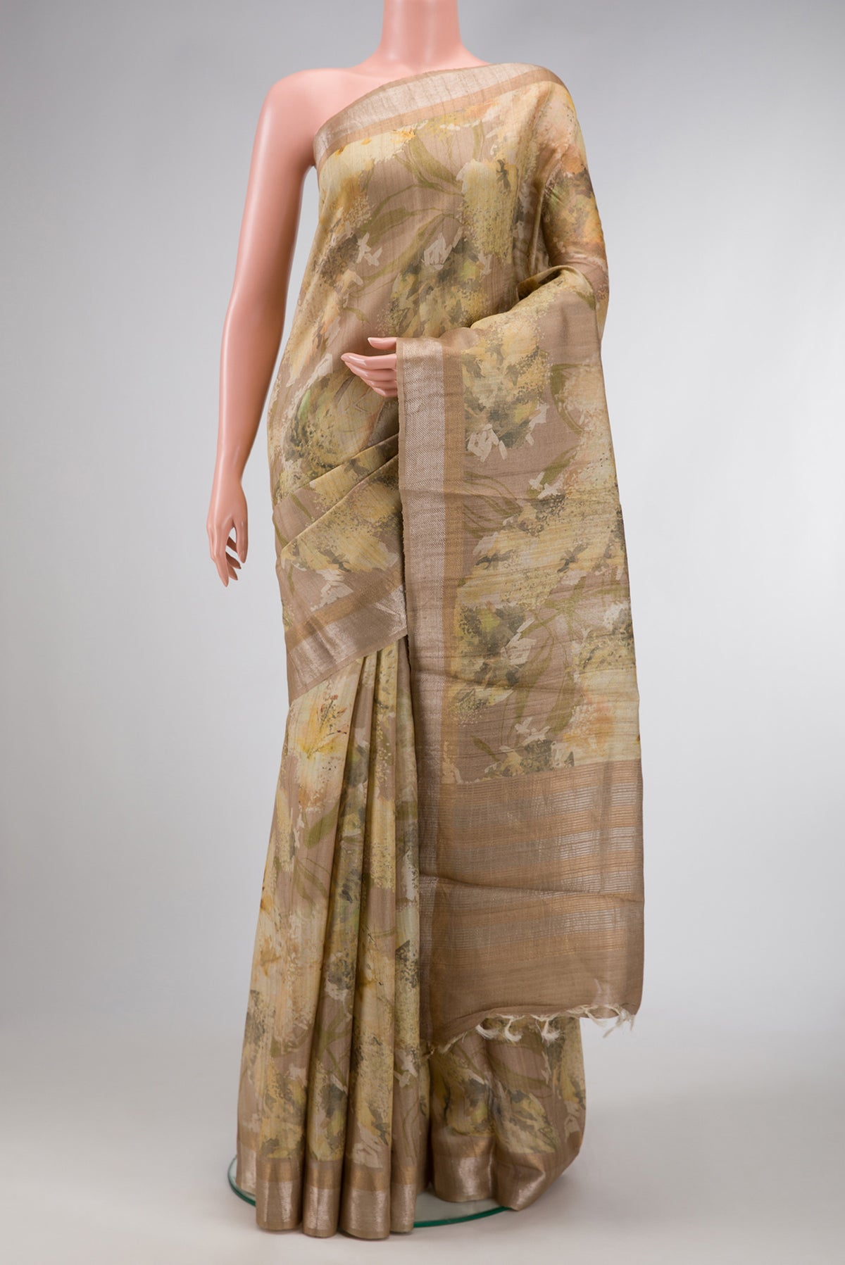 Dark Beige Dual Tone Tussar Silk Saree with Printed design on the body and Zari Border.  displayed on a mannequin