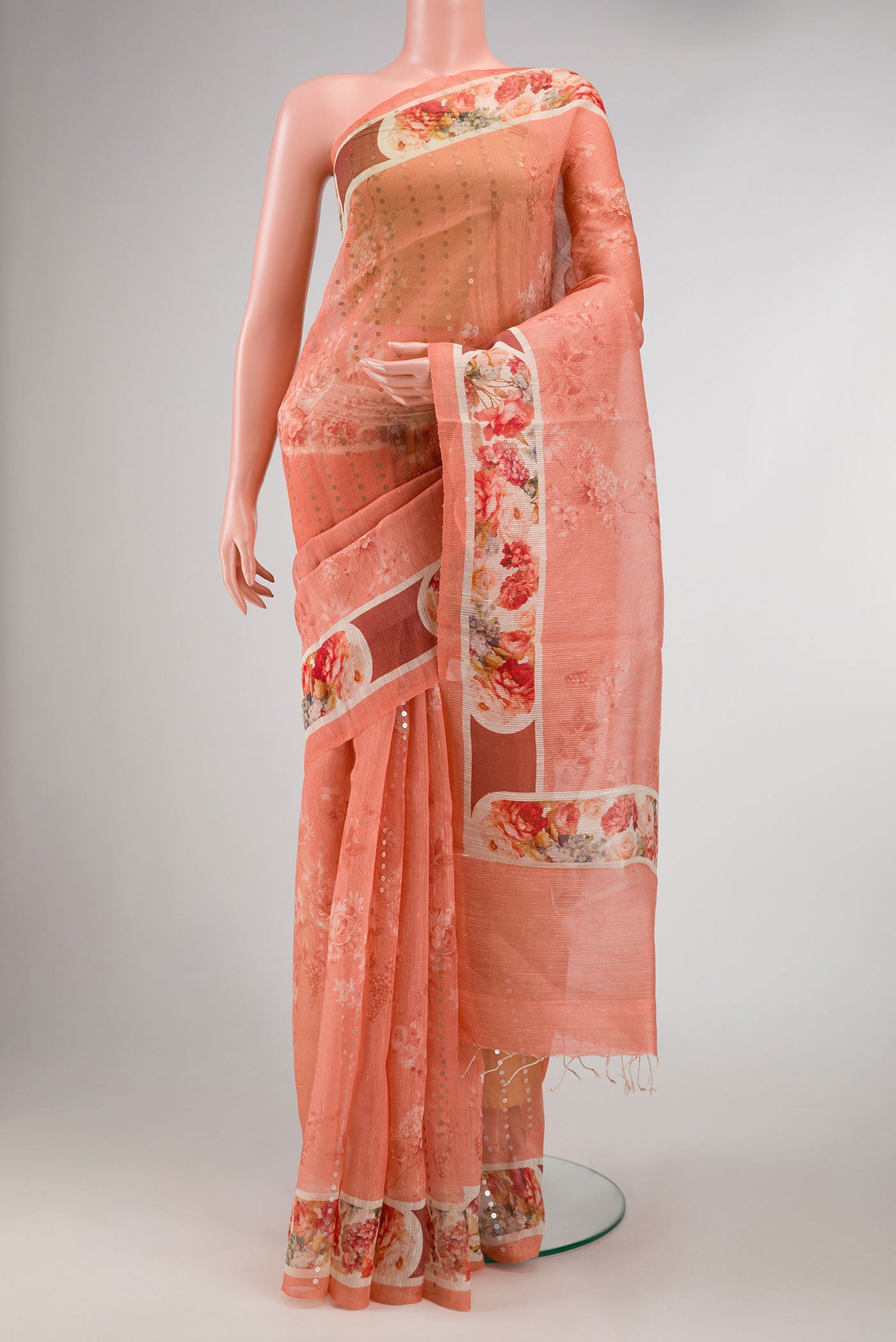 Peach Dual Tone Tussar Silk Saree with Embroidery on the body and Embroidery Border displayed on a mannequin