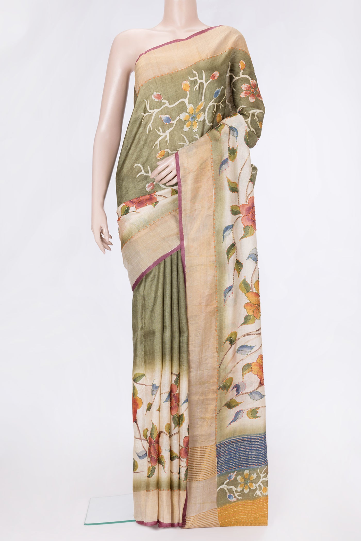 Beige Dual Tone Tussar Silk Saree with Embroidery on the body and Zari Border.  displayed on a mannequin