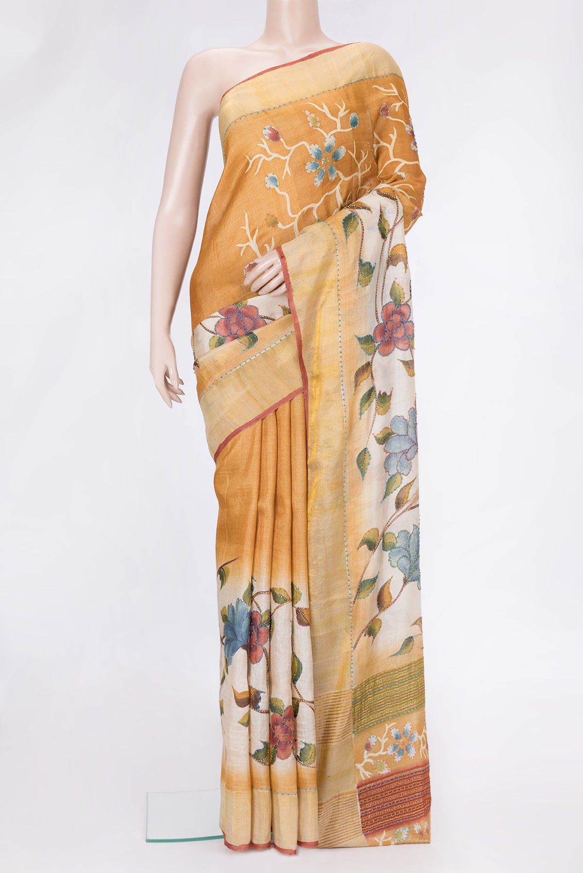 Mustard Dual Tone Tussar Silk Saree with Embroidery on the body and Zari Border.  displayed on a mannequin