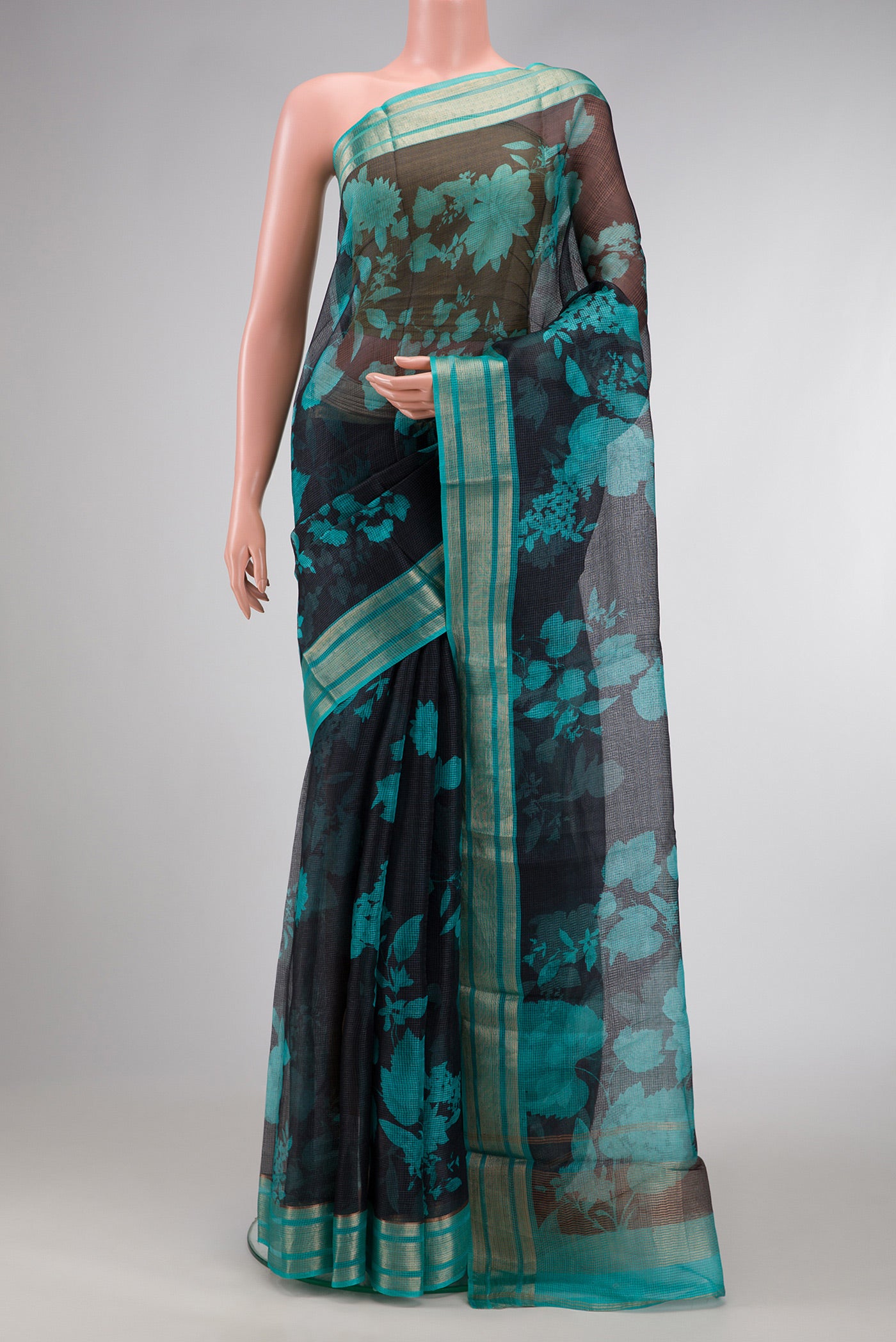 Black Dual Tone Tussar Silk Saree with Printed design on the body and Zari Border.  displayed on a mannequin