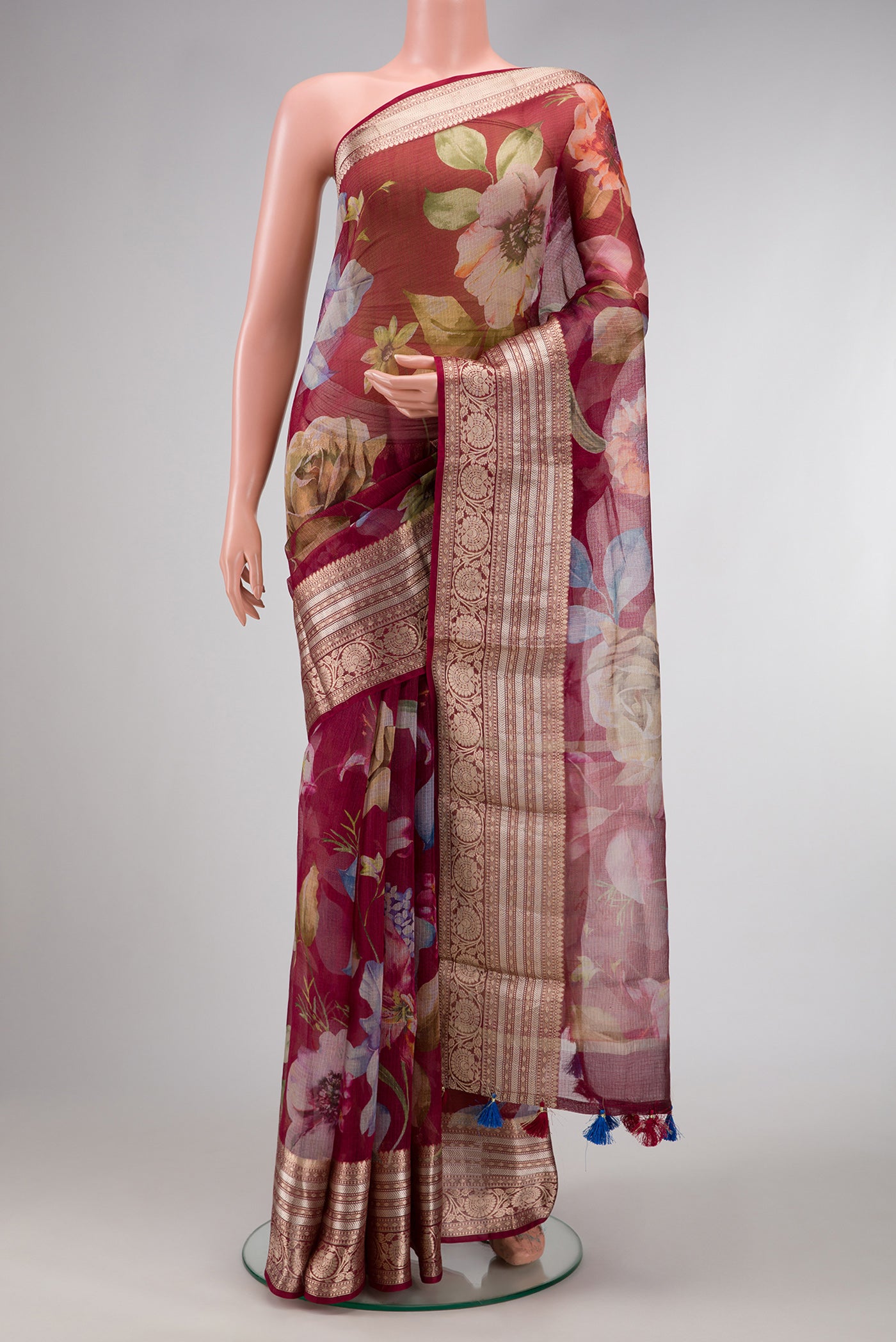 Maroon Dual Tone Tussar Silk Saree with Printed design on the body and Zari Border.  displayed on a mannequin