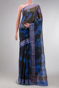 Black Dual Tone Tussar Silk Saree with Printed design on the body and Zari Border.  displayed on a mannequin