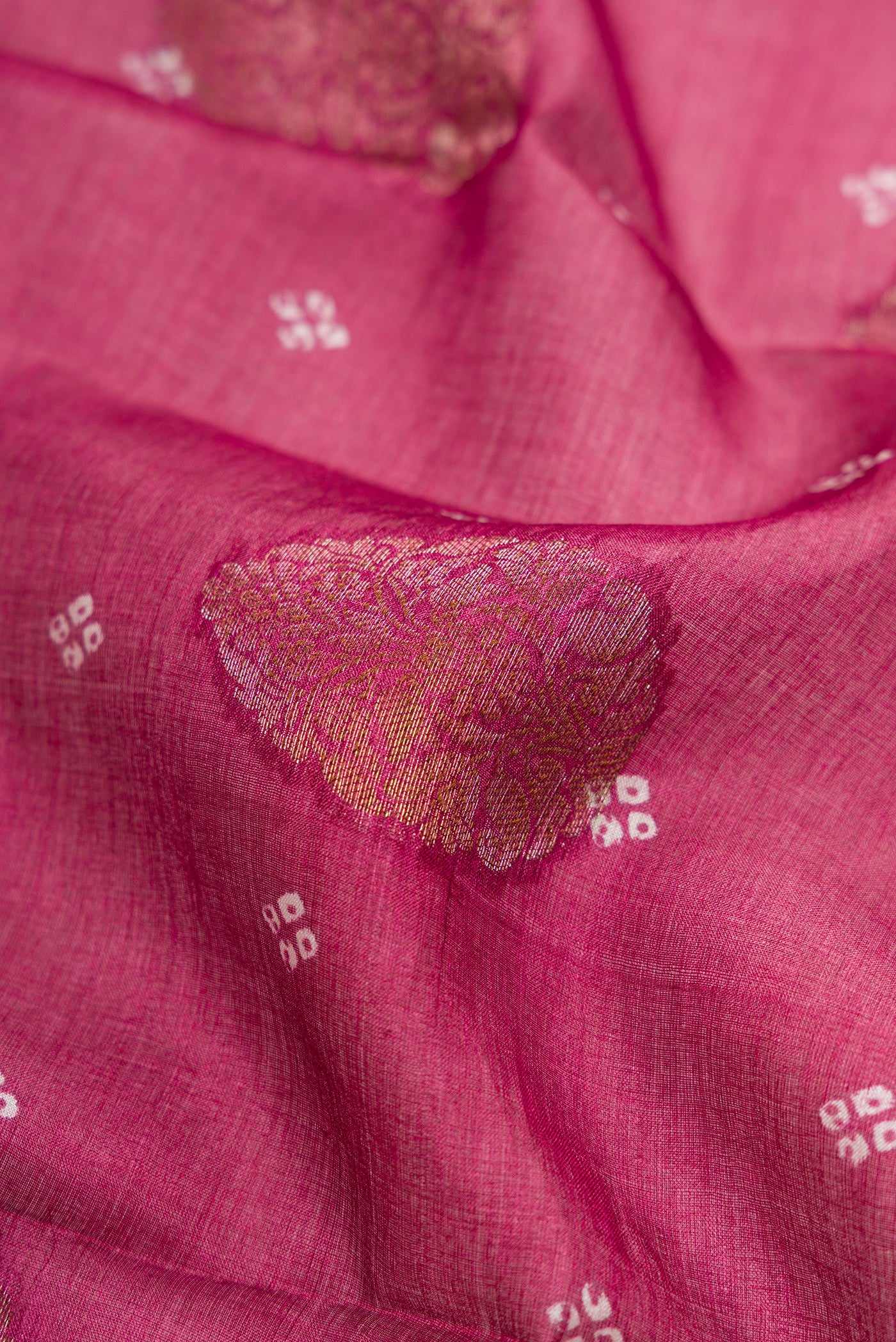 Close up of Maroon Tussar Silk Saree with Printed design on the body and Fancy Border.  displaying folds
