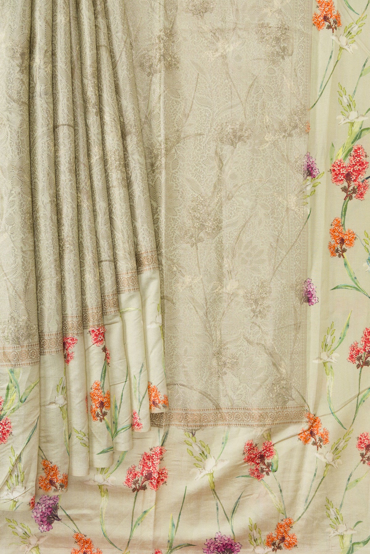 Pleats and pallu of Light Green Dual Tone Tussar Silk Saree with Printed design on the body and Printed Border. 
