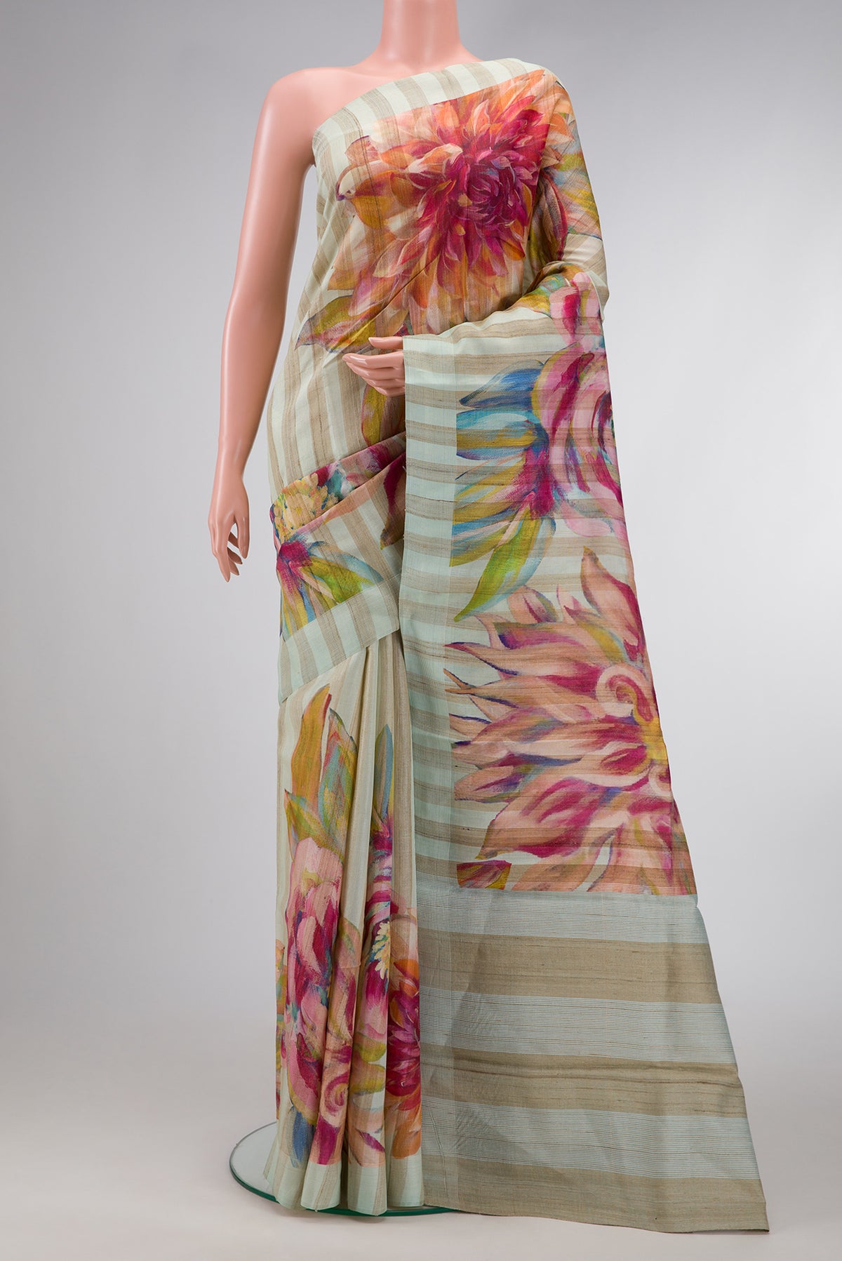 Pista Green Dual Tone Tussar Silk Saree with Stripes on the body and Fancy Border.  displayed on a mannequin
