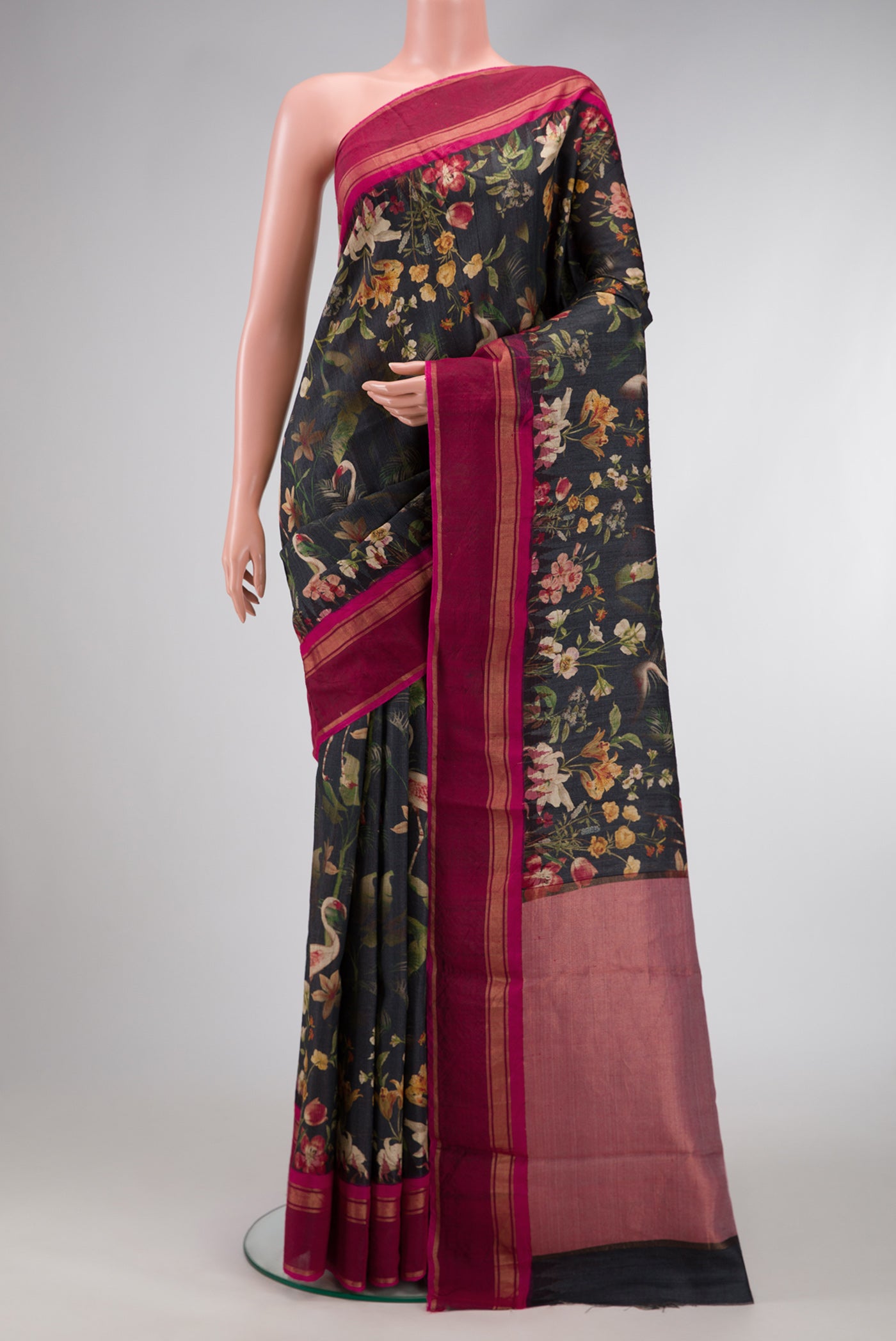 Black Dual Tone Tussar Silk Saree with Printed design on the body and Zari Border.  displayed on a mannequin