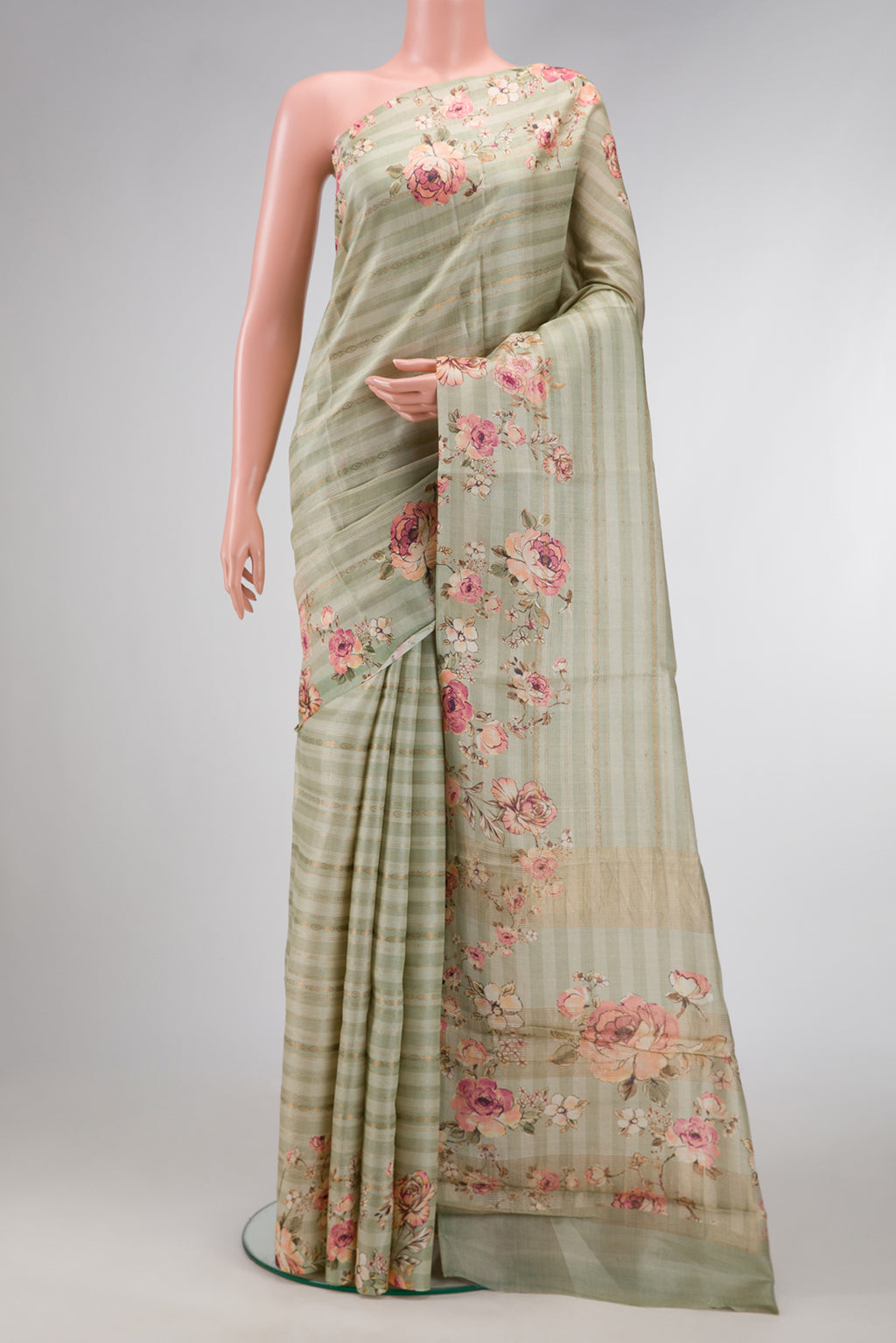 Pista Green Dual Tone Tussar Silk Saree with Printed design on the body and Printed Border.  displayed on a mannequin
