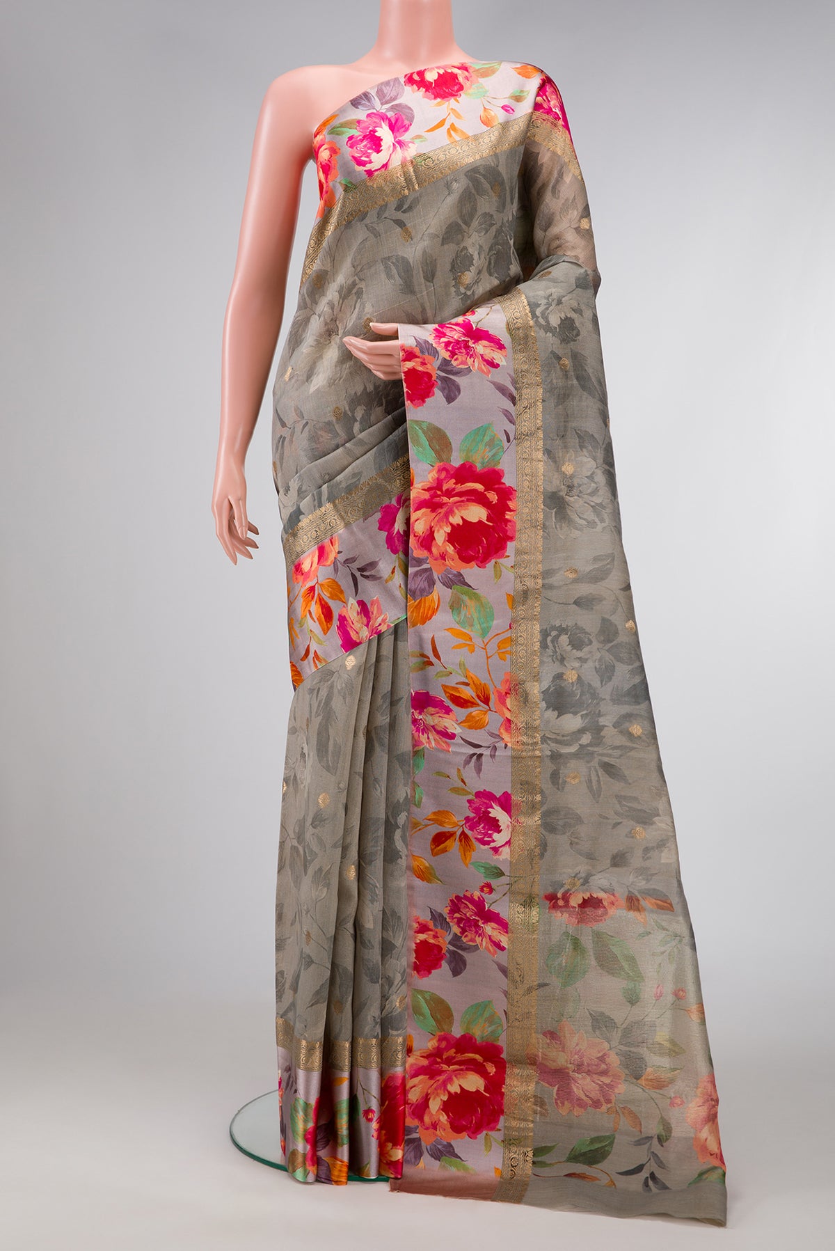 Grey Dual Tone Tussar Silk Saree with Zari Butta on the body and Zari Border.  displayed on a mannequin
