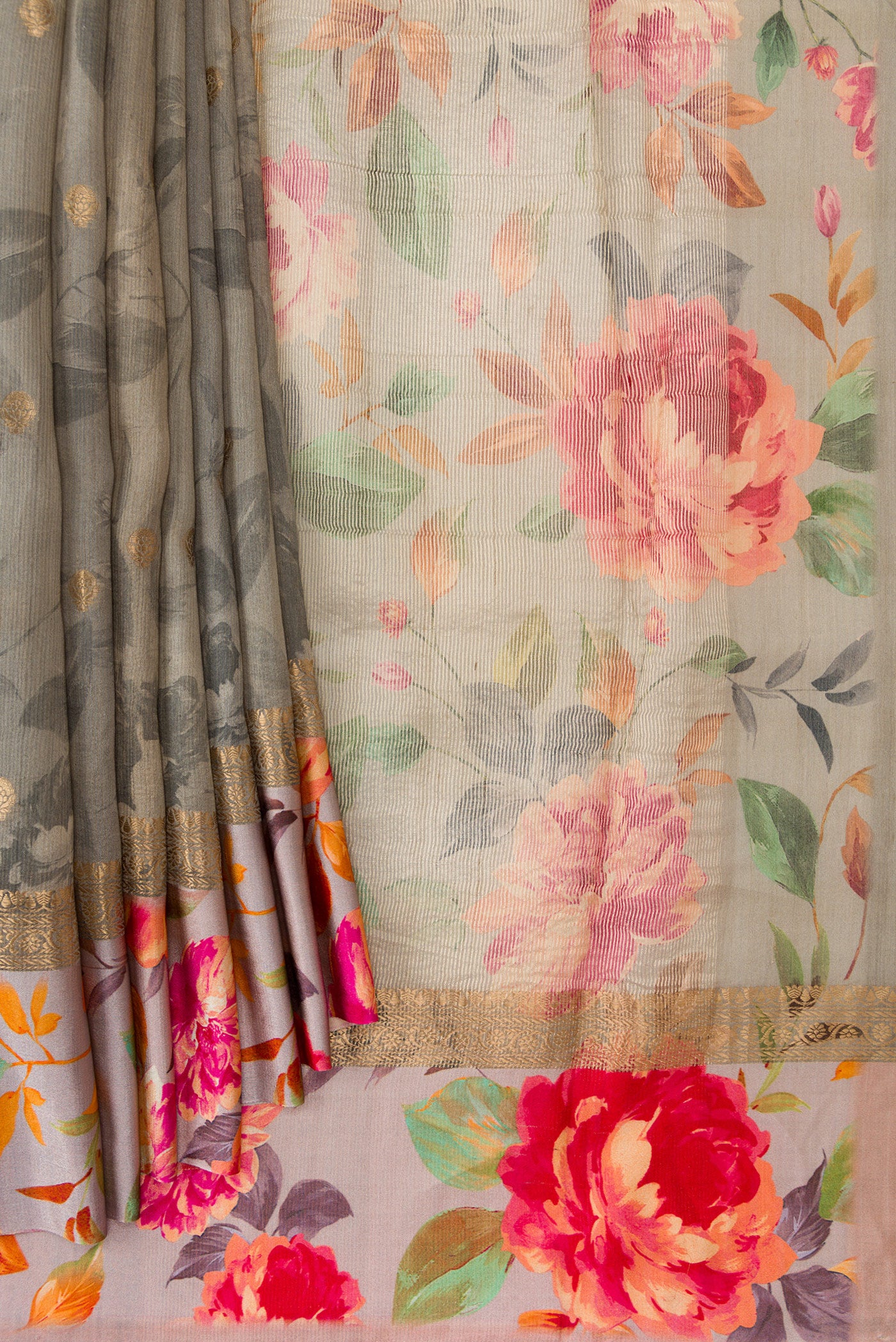 Pleats and pallu of Grey Dual Tone Tussar Silk Saree with Zari Butta on the body and Zari Border. 