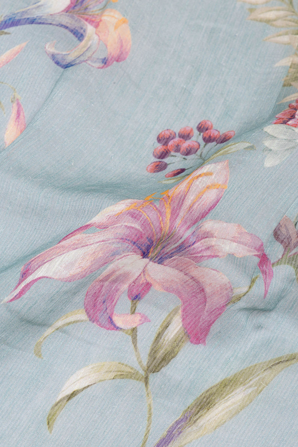 Close up of Grey Linen Saree with Floral Print on the body and Zari Border.  displaying folds