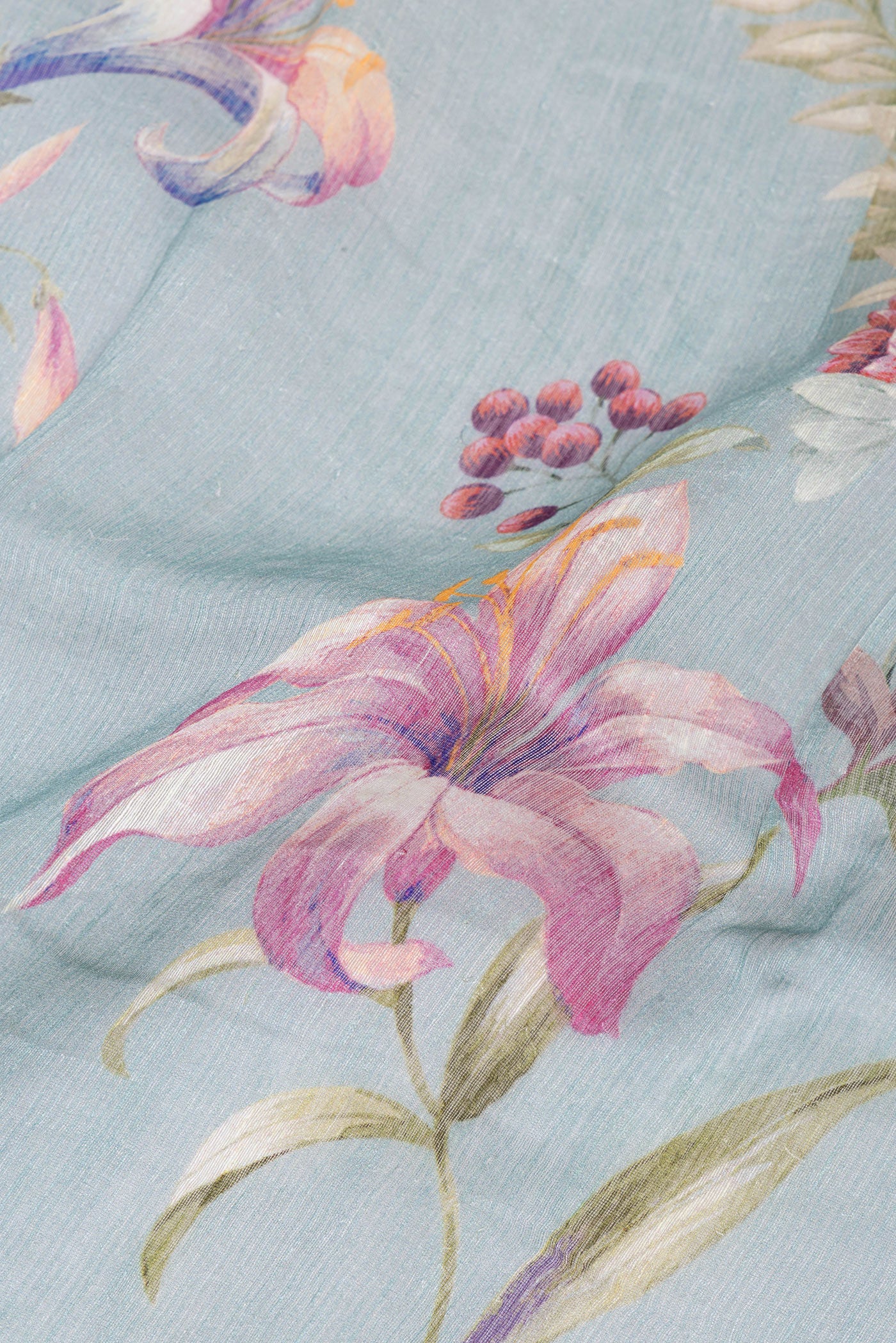 Close up of Grey Linen Saree with Floral Print on the body and Zari Border.  displaying folds