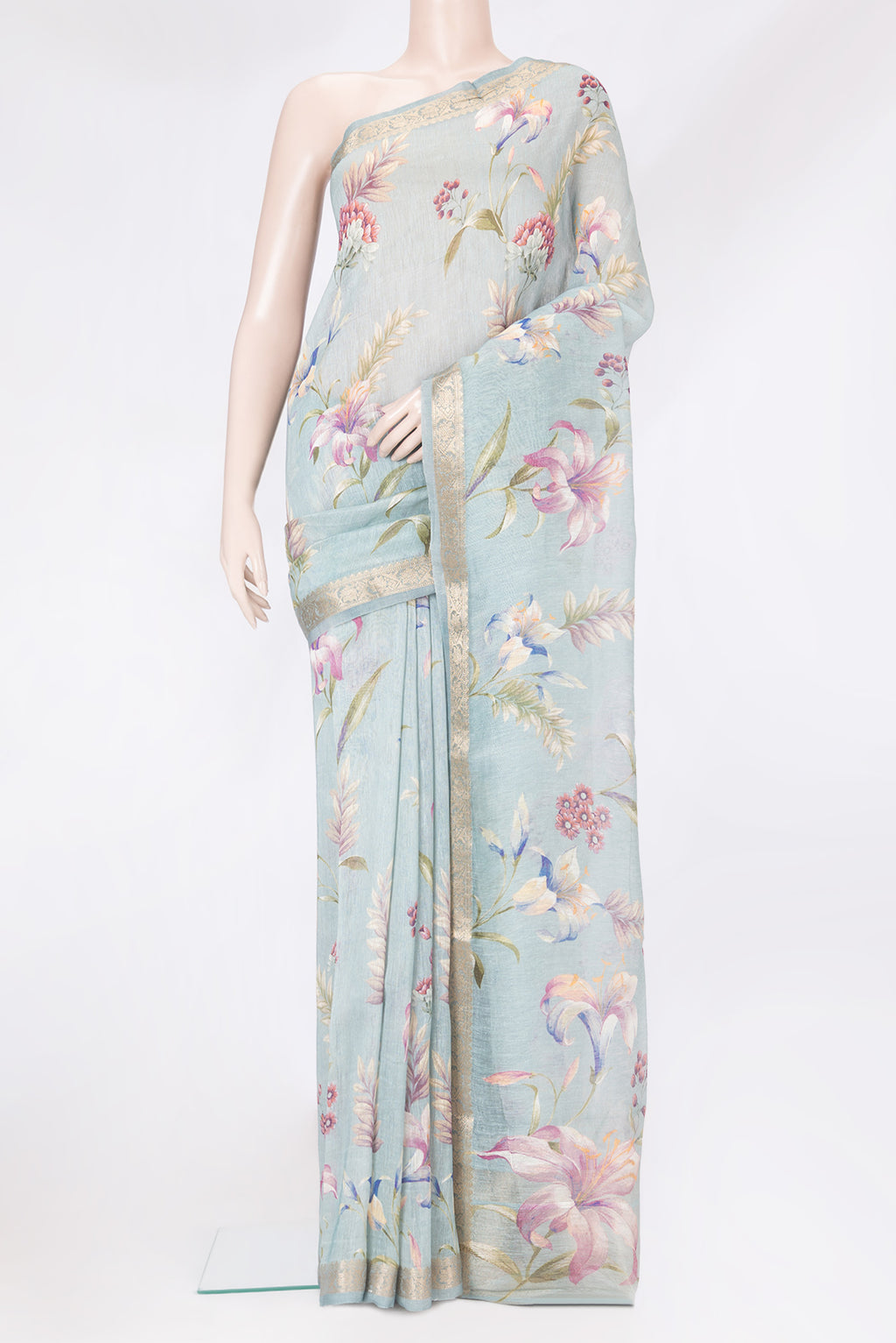 Grey Linen Saree with Floral Print on the body and Zari Border.  displayed on a mannequin