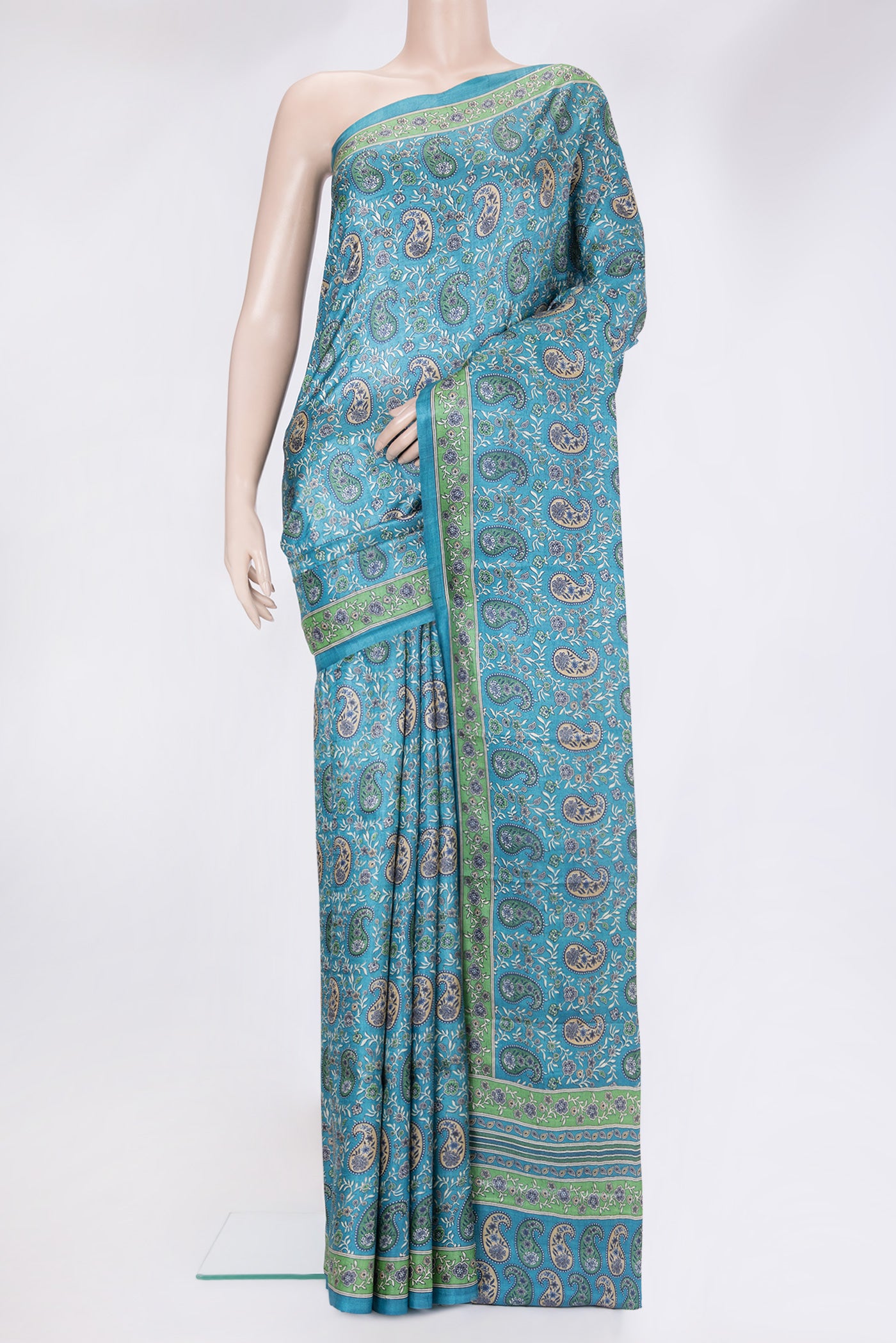 Sky Blue Tussar Silk Saree with Printed design on the body and Printed Border.  displayed on a mannequin