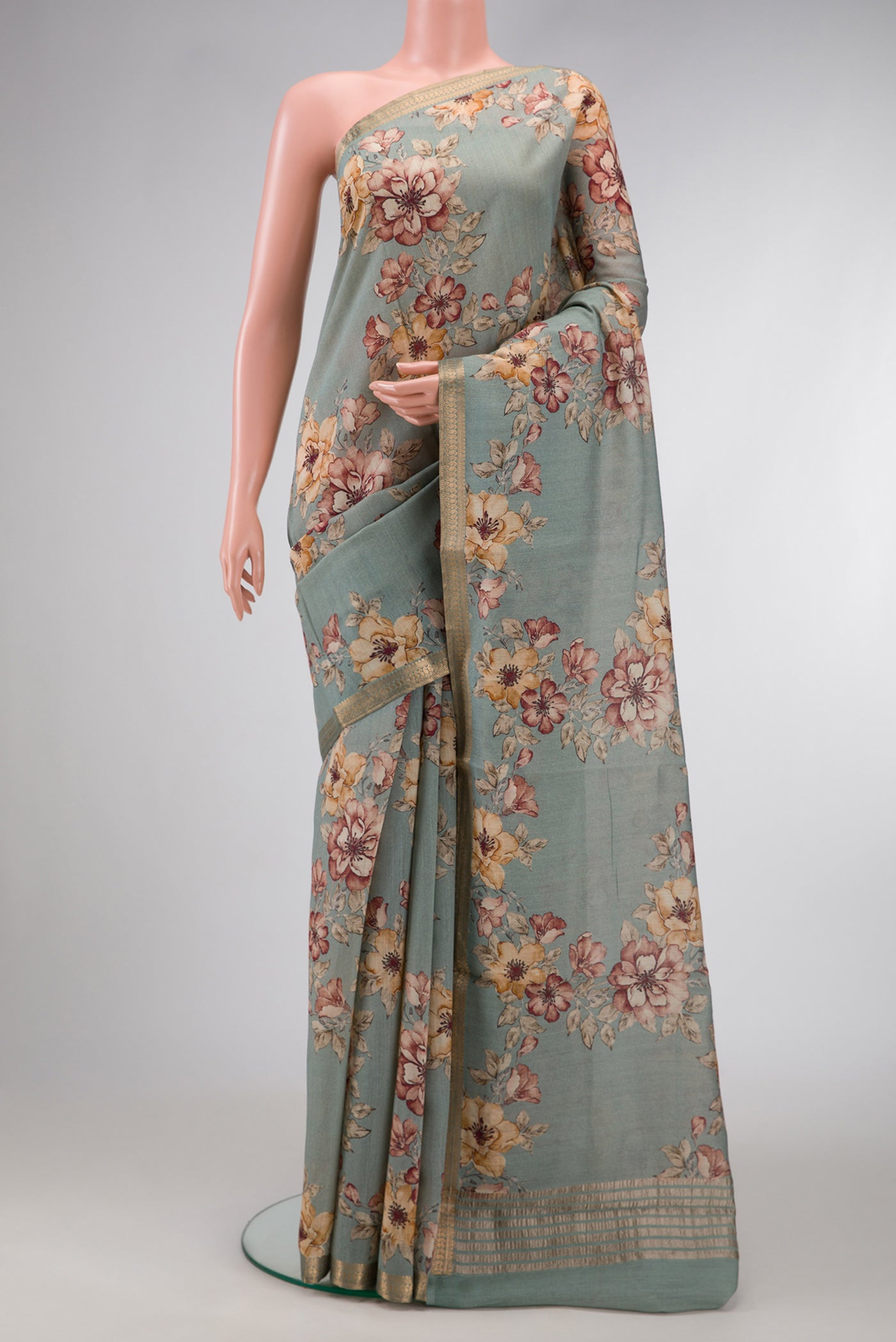 Grey Dual Tone Tussar Silk Saree with Printed design on the body and Embroidery Border.  displayed on a mannequin