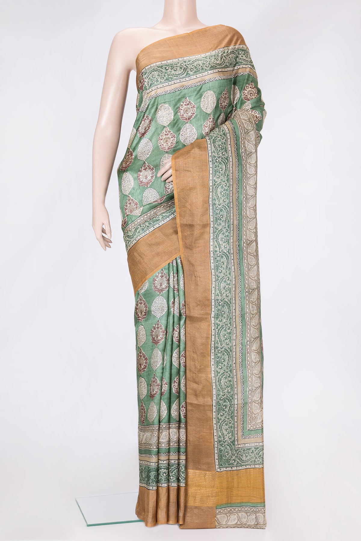 Green Dual Tone Tussar Silk Saree with Embroidery on the body and Zari Border.  displayed on a mannequin