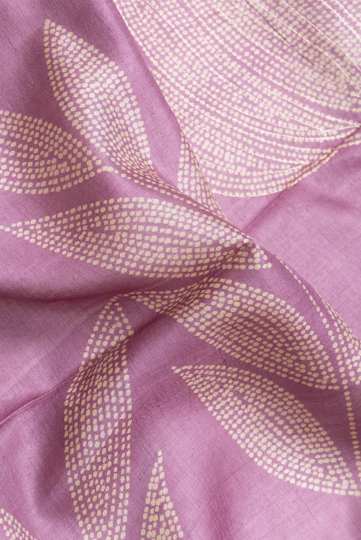 Close up of Pink Dual Tone Tussar Silk Saree with Embroidery on the body and Zari Border.  displaying folds