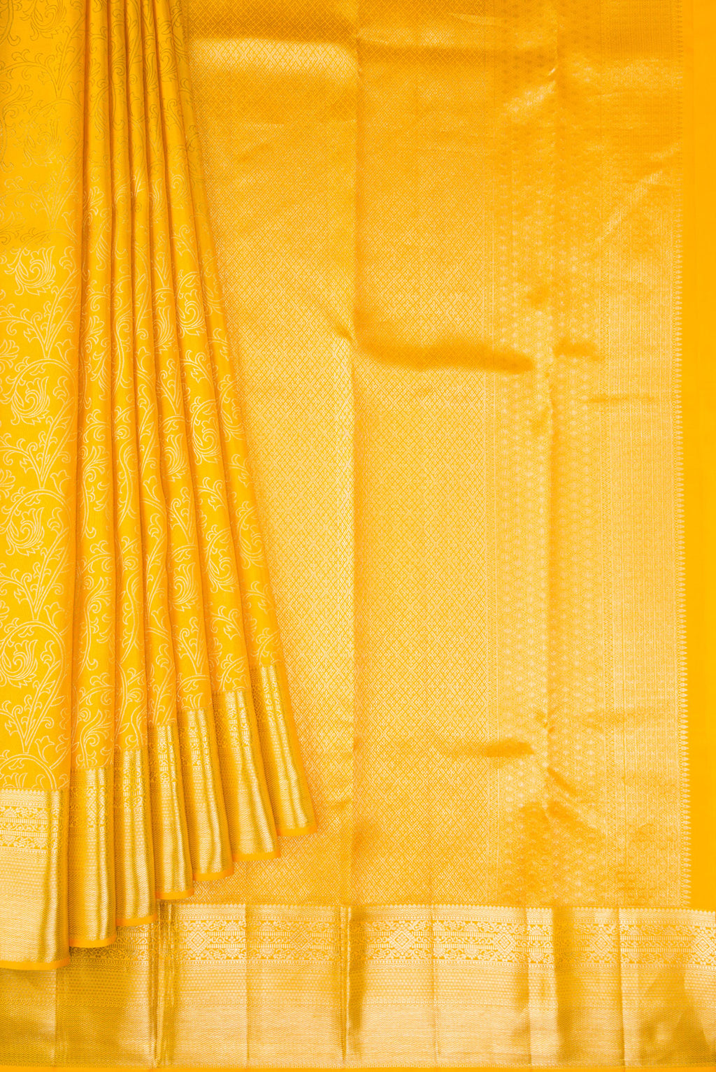 Pleats and pallu of Gold Dual Tone Kanchipuram Silk Saree with Zari Butta on the body and Zari Border. 