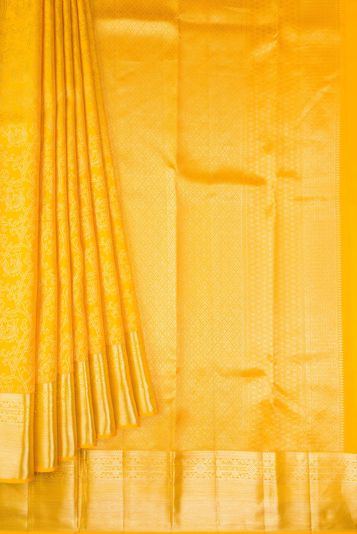 Pleats and pallu of Gold Dual Tone Kanchipuram Silk Saree with Zari Butta on the body and Zari Border. 
