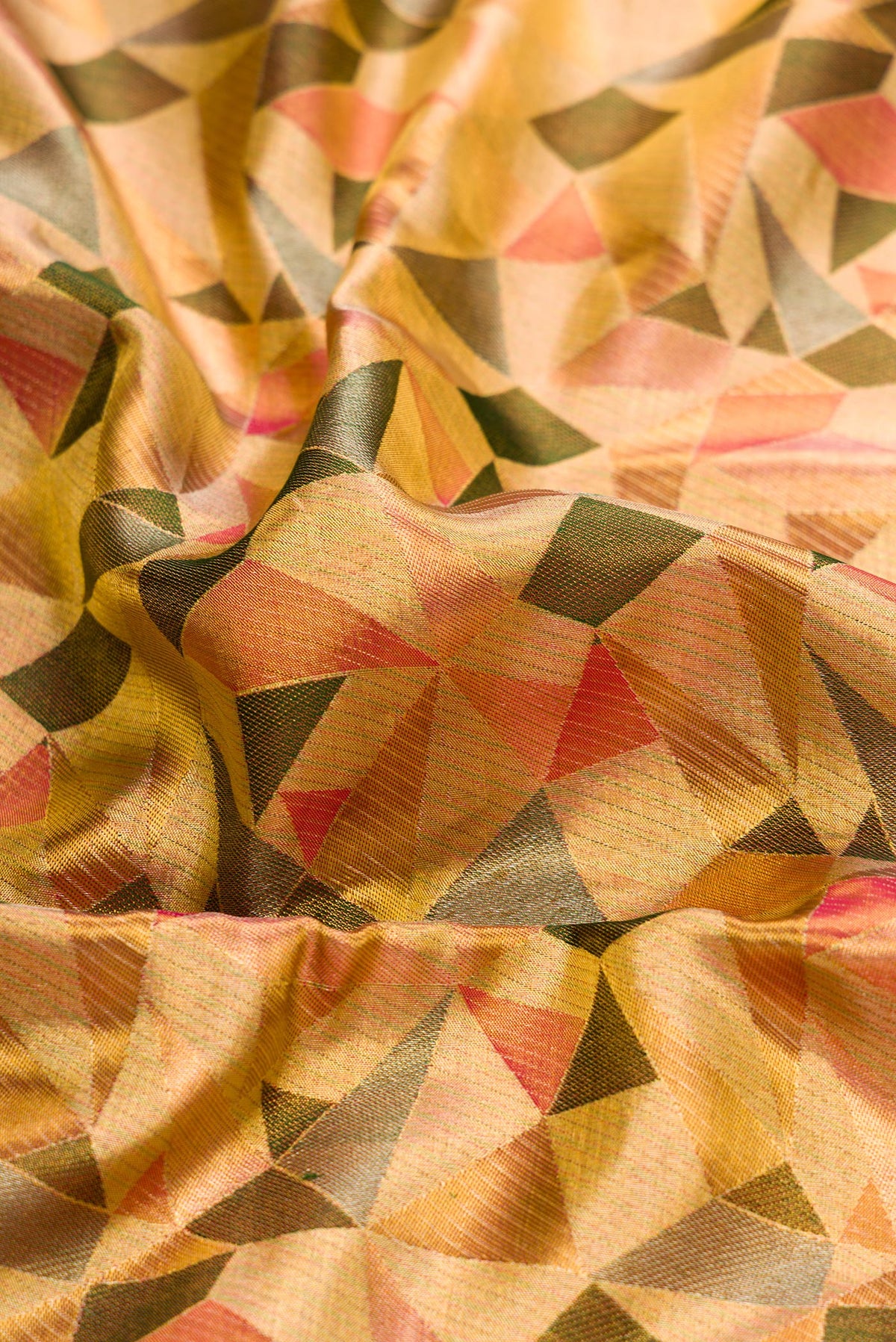 Close up of Gold Dual Tone Kanjivaram Tissue Silk Saree with Zari Brocade on the body and Zari Border.  displaying folds