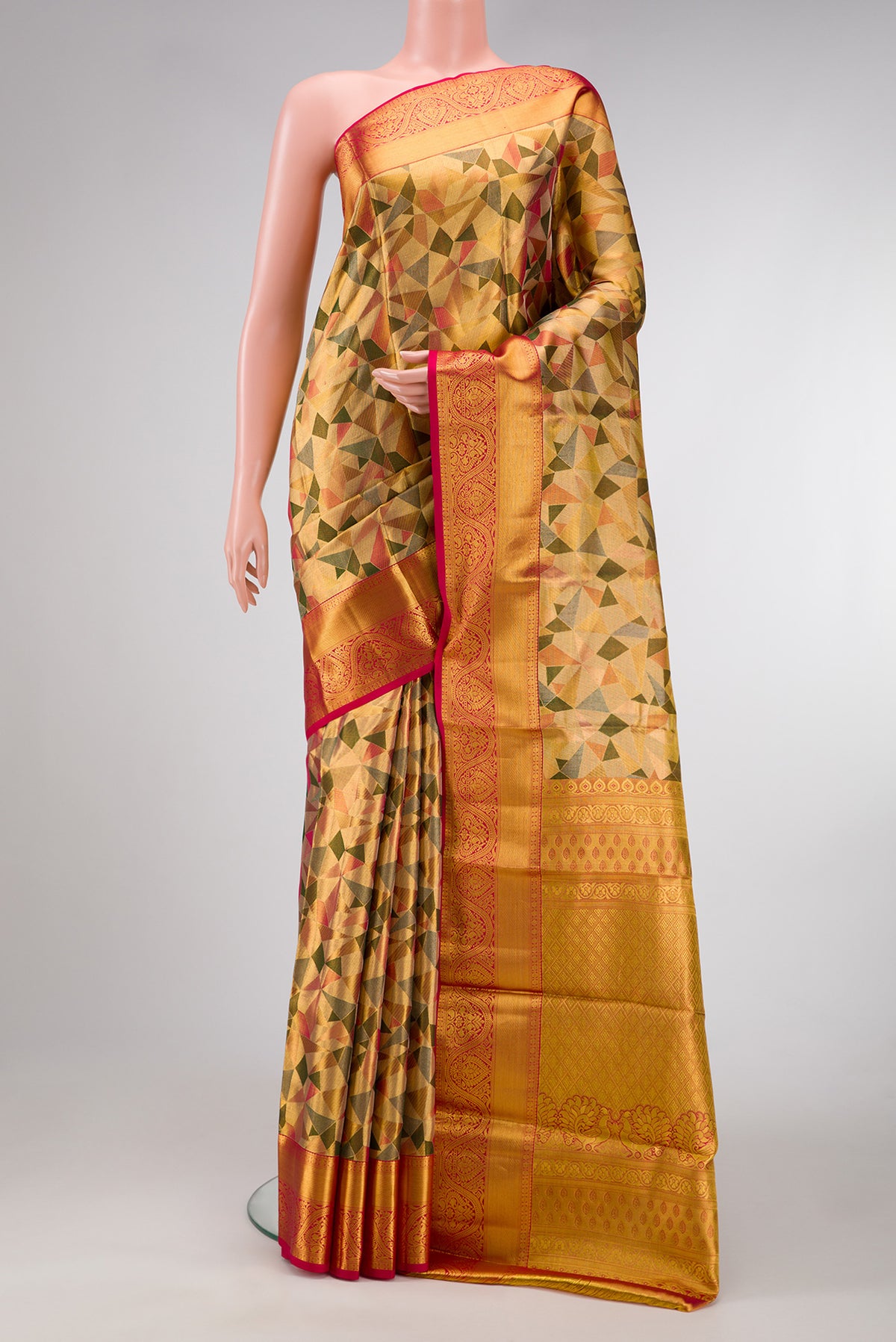 Gold Dual Tone Kanjivaram Tissue Silk Saree with Zari Brocade on the body and Zari Border.  displayed on a mannequin