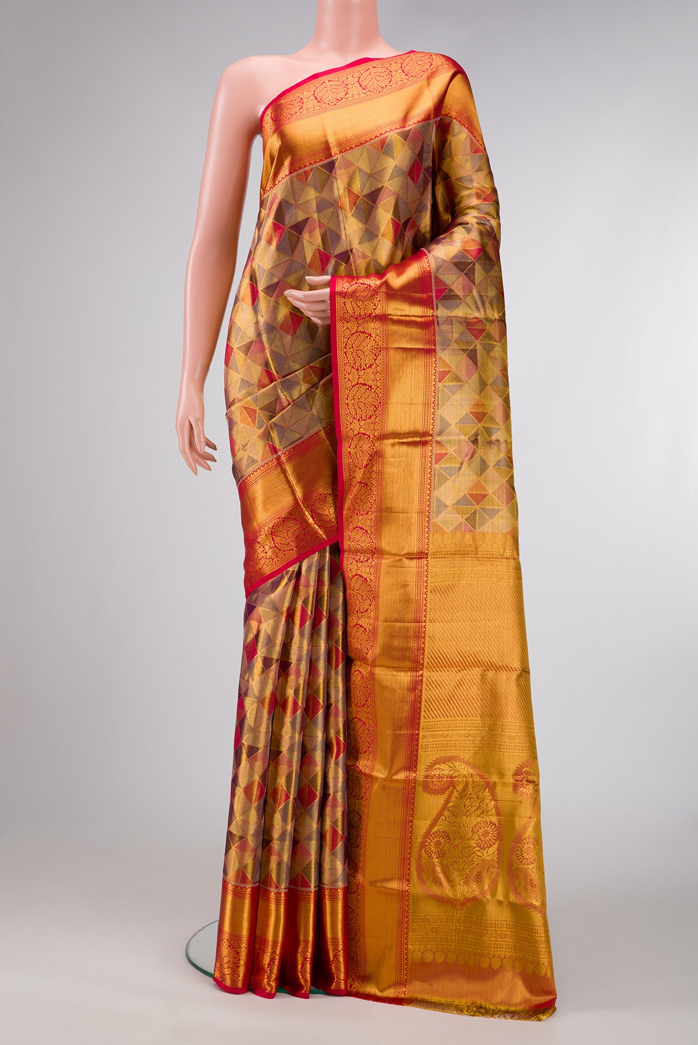 Gold Dual Tone Kanjivaram Tissue Silk Saree with Zari Brocade on the body and Zari Border.  displayed on a mannequin