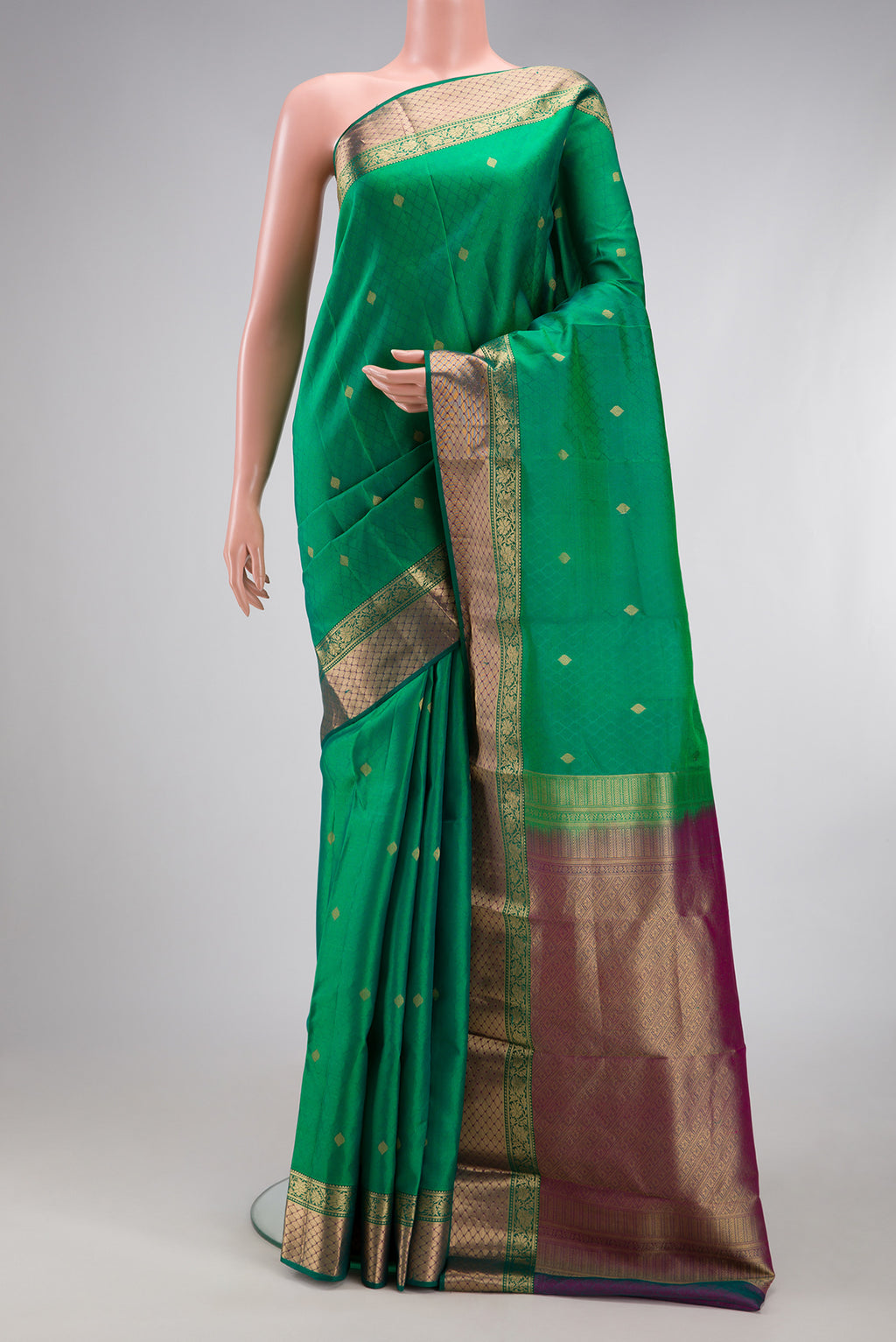 Green Kanchipuram Silk Saree with Jacquard With Zari Butta on the body and Zari Border.  displayed on a mannequin