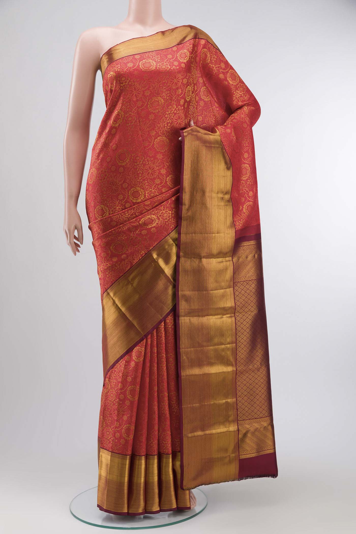Red Kanchipuram Silk Saree with Zari Brocade on the body and Zari Border displayed on a mannequin