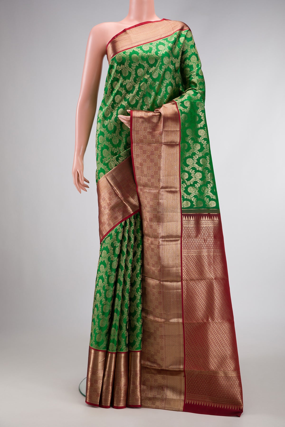 Green Dual Tone Kanchipuram Silk Saree with Zari Brocade on the body and Zari Border.  displayed on a mannequin