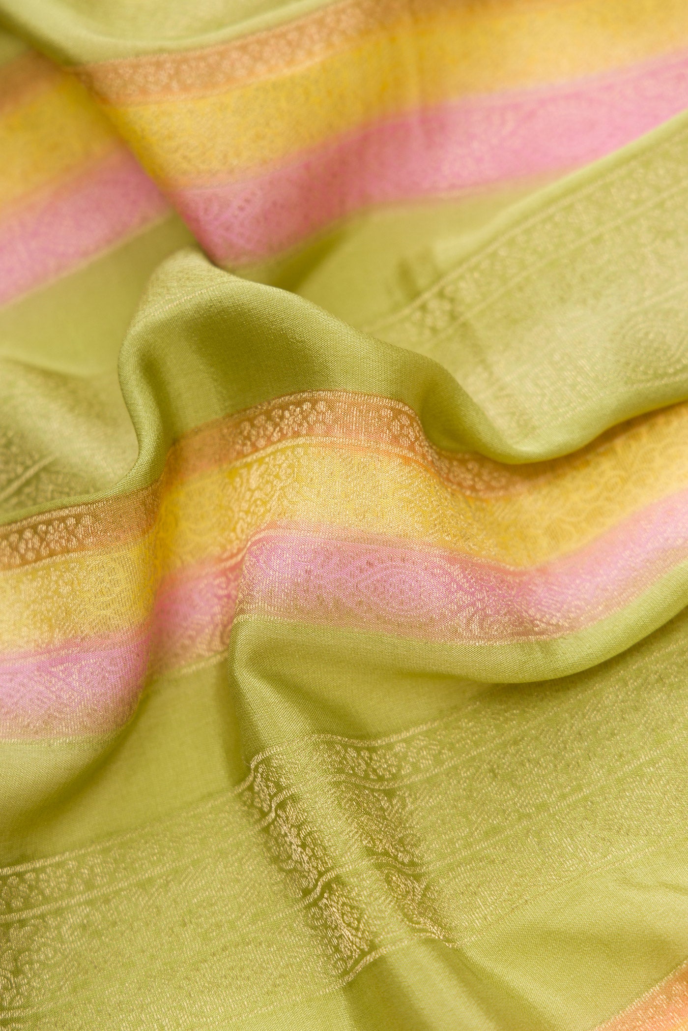 Close up of Pista Green Dual Tone Mysore Silk Saree with Stripes on the body and Zari Border.  displaying folds