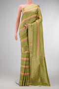 Pista Green Dual Tone Mysore Silk Saree with Stripes on the body and Zari Border.  displayed on a mannequin