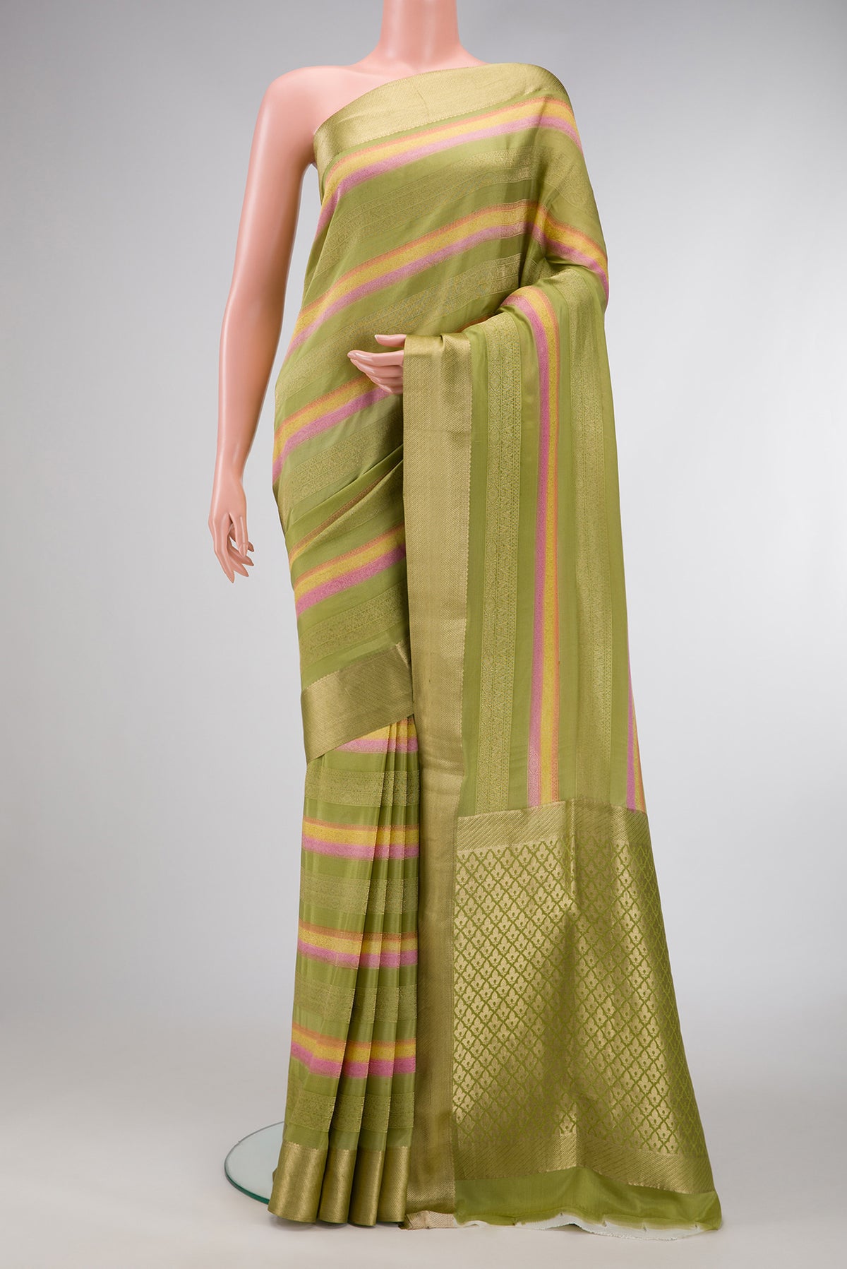 Pista Green Dual Tone Mysore Silk Saree with Stripes on the body and Zari Border.  displayed on a mannequin
