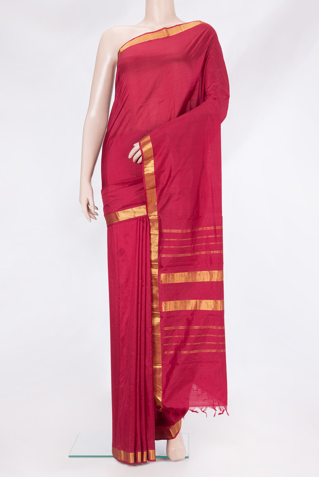 Maroon Kanjivaram Silk Saree with Plain Body and Zari Border.  displayed on a mannequin