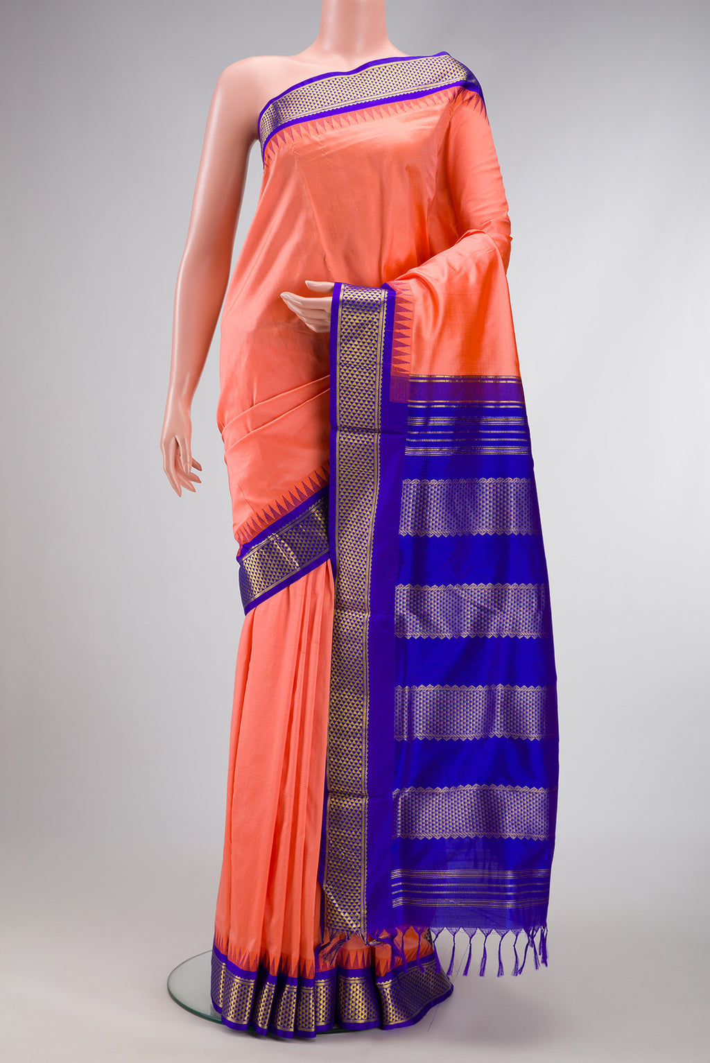 Peach Dual Tone Kanchipuram Silk Nine Yards Saree with Stripes on the body and Zari Border.  displayed on a mannequin