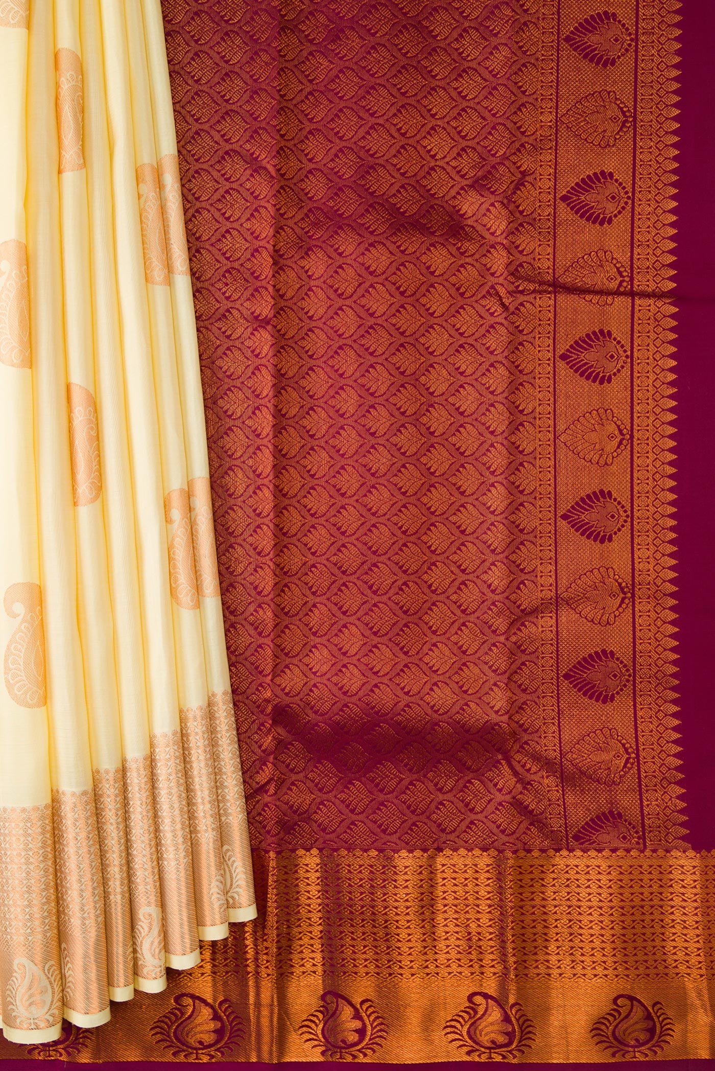 Pleats and pallu of Sandal Dual Tone Kanjivaram Silk Saree with Zari Butta on the body and Zari Border. 