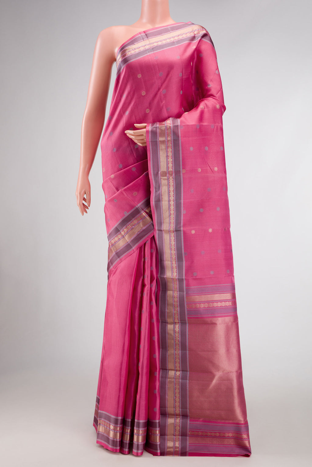 Pink Dual Tone Kanchipuram Silk Saree with Zari And Thread Butta on the body and Zari Border.  displayed on a mannequin