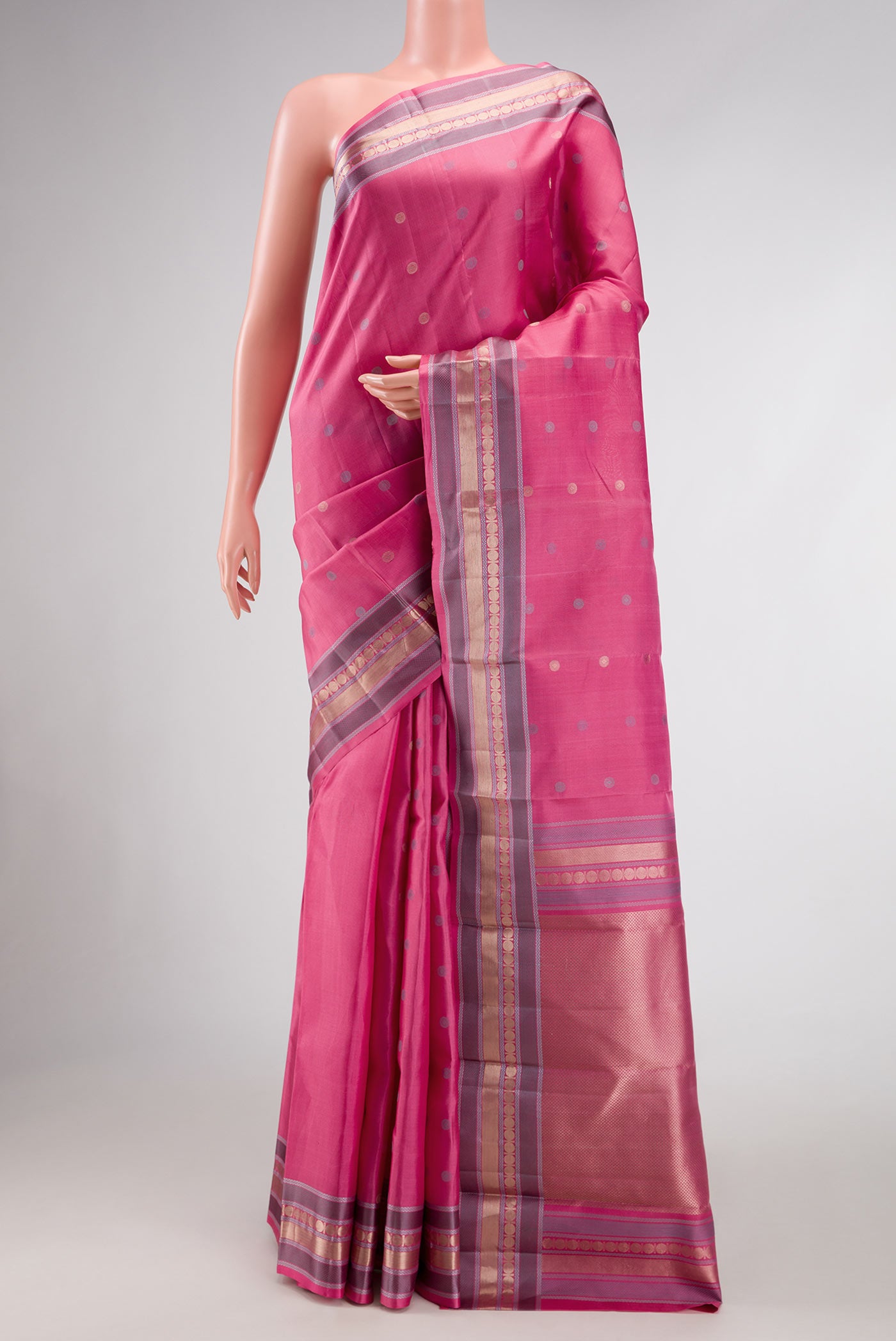 Pink Dual Tone Kanchipuram Silk Saree with Zari And Thread Butta on the body and Zari Border.  displayed on a mannequin
