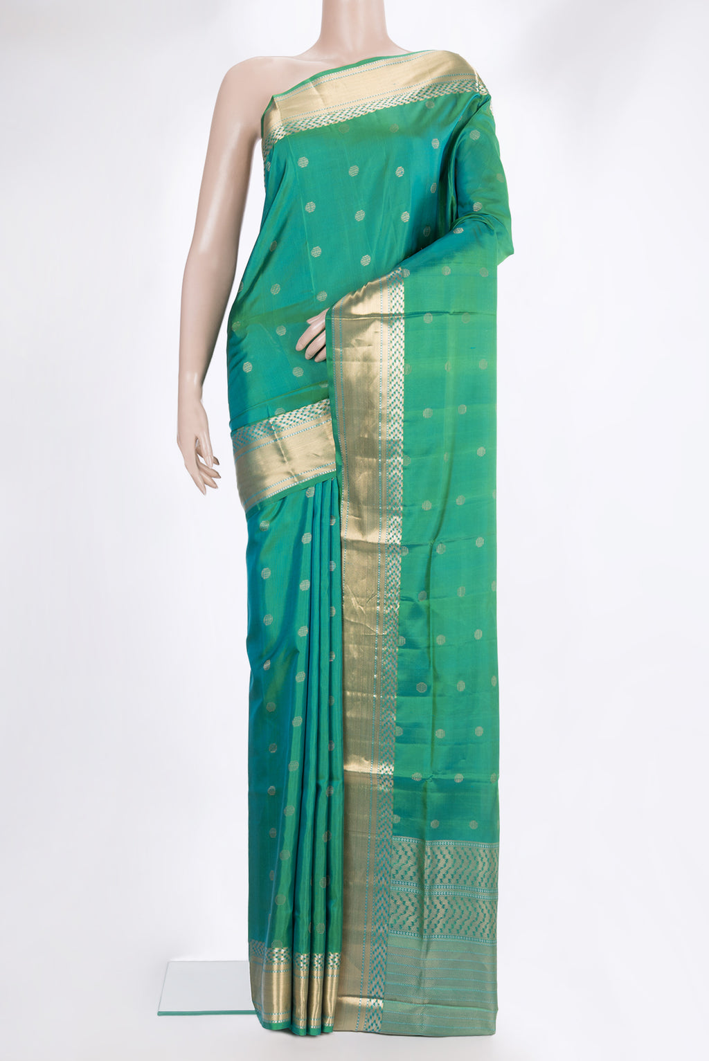 Pure Silk Sea Green Dual Tone Soft Saree with Zari Butta on the body and Zari Border.  displayed on a mannequin