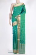 Pure Silk Sea Green Dual Tone Soft Saree with Zari Butta on the body and Zari Border.  displayed on a mannequin