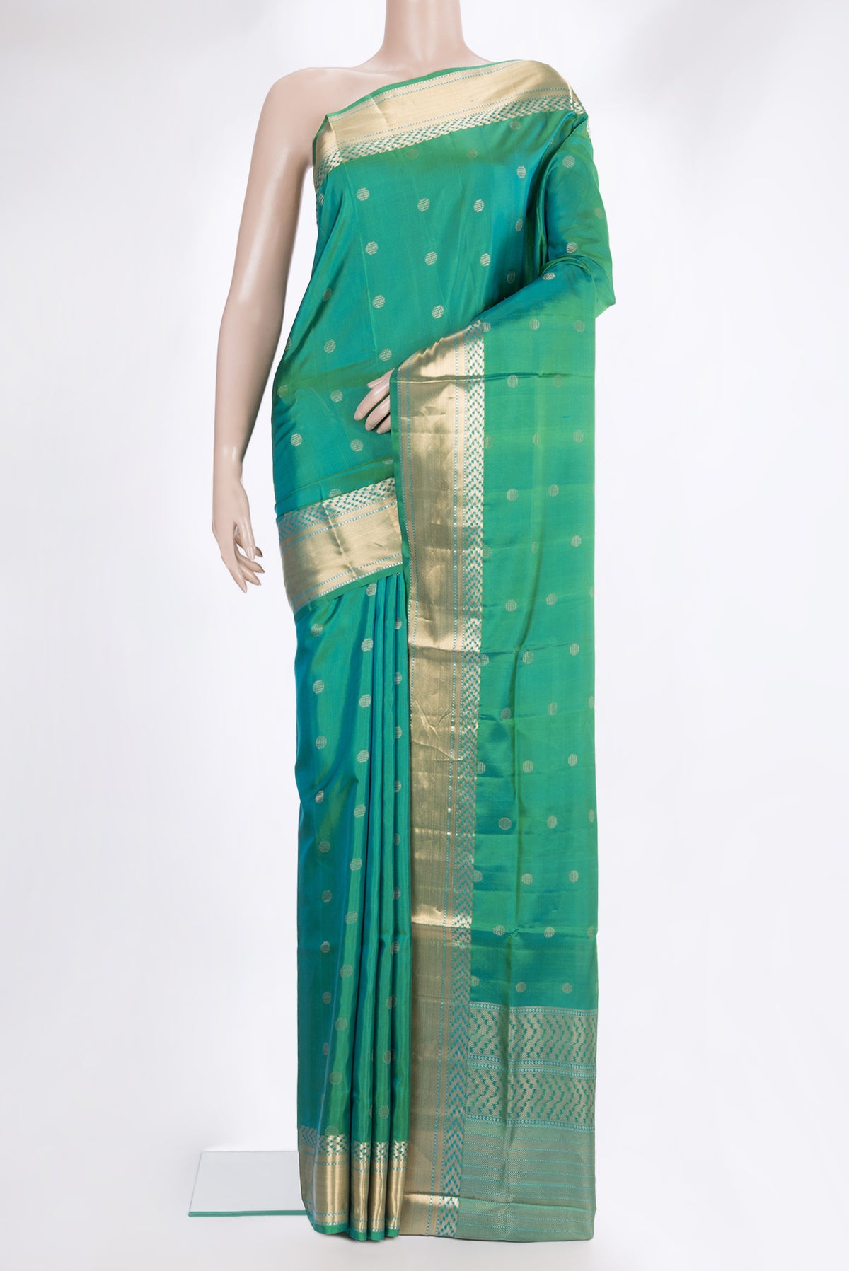 Pure Silk Sea Green Dual Tone Soft Saree with Zari Butta on the body and Zari Border.  displayed on a mannequin