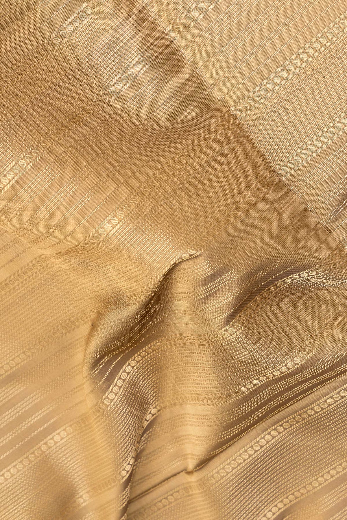 Close up of Pure Silk Brown Soft Saree with Stripes on the body and Zari Border.  displaying folds