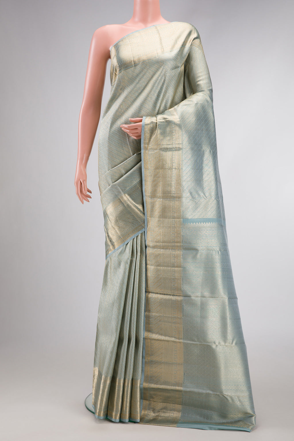 Grey Dual Tone Kanchipuram Silk Saree with Zari Brocade on the body and Zari Border.  displayed on a mannequin