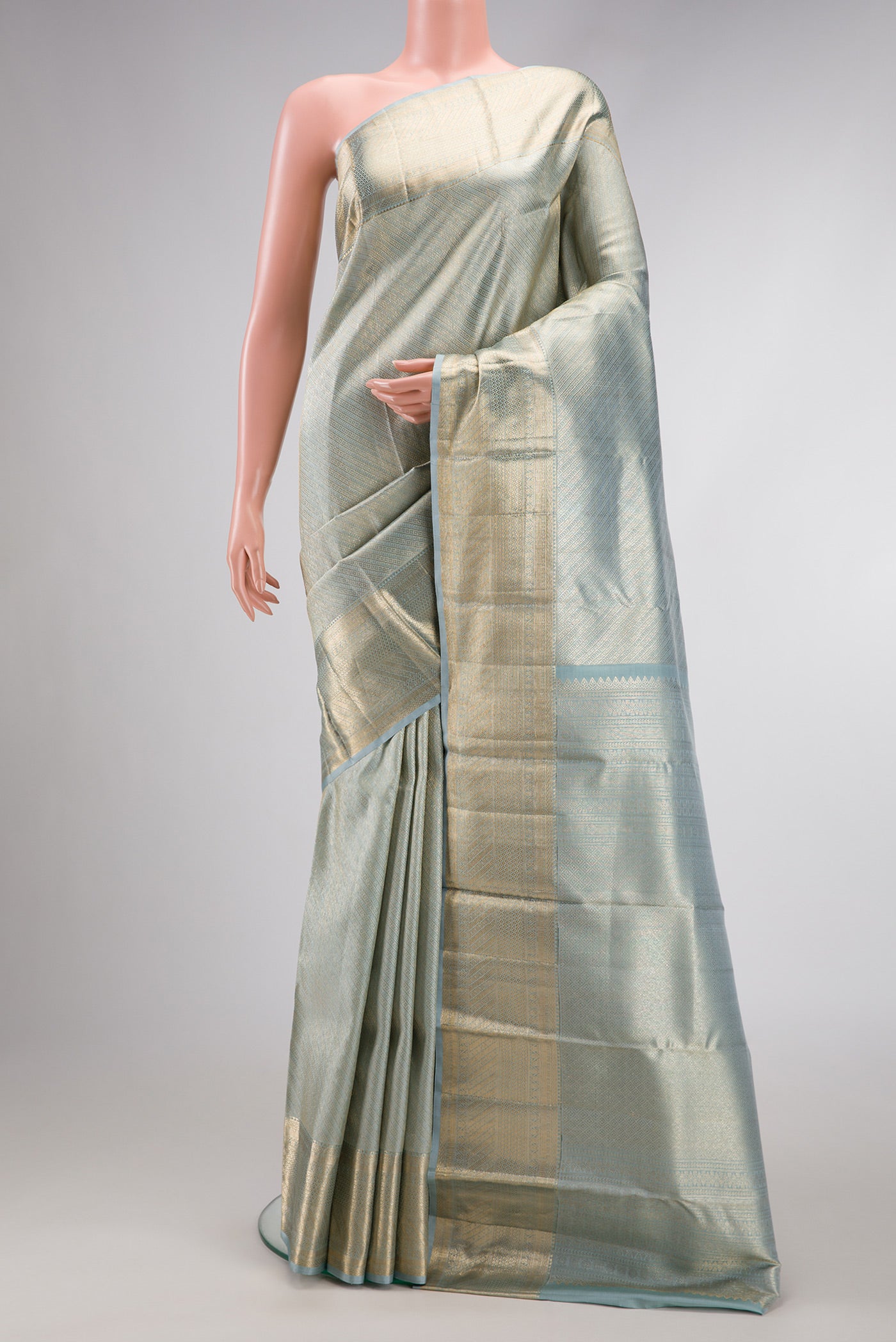 Grey Dual Tone Kanchipuram Silk Saree with Zari Brocade on the body and Zari Border.  displayed on a mannequin