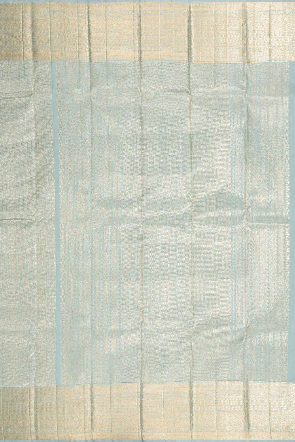 Close up image of the pallu of Grey Dual Tone Kanchipuram Silk Saree with Zari Brocade on the body and Zari Border. 