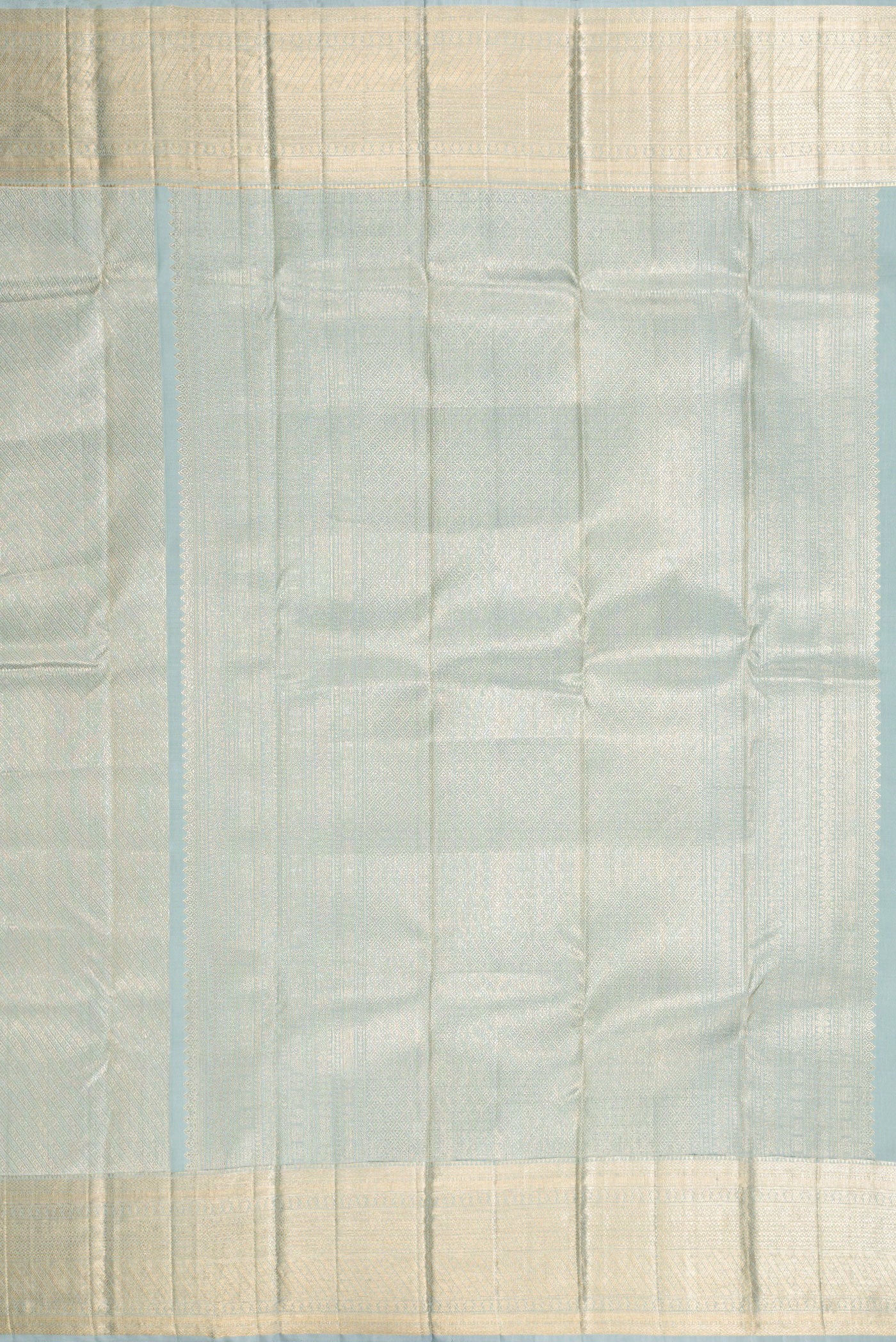 Close up image of the pallu of Grey Dual Tone Kanchipuram Silk Saree with Zari Brocade on the body and Zari Border. 