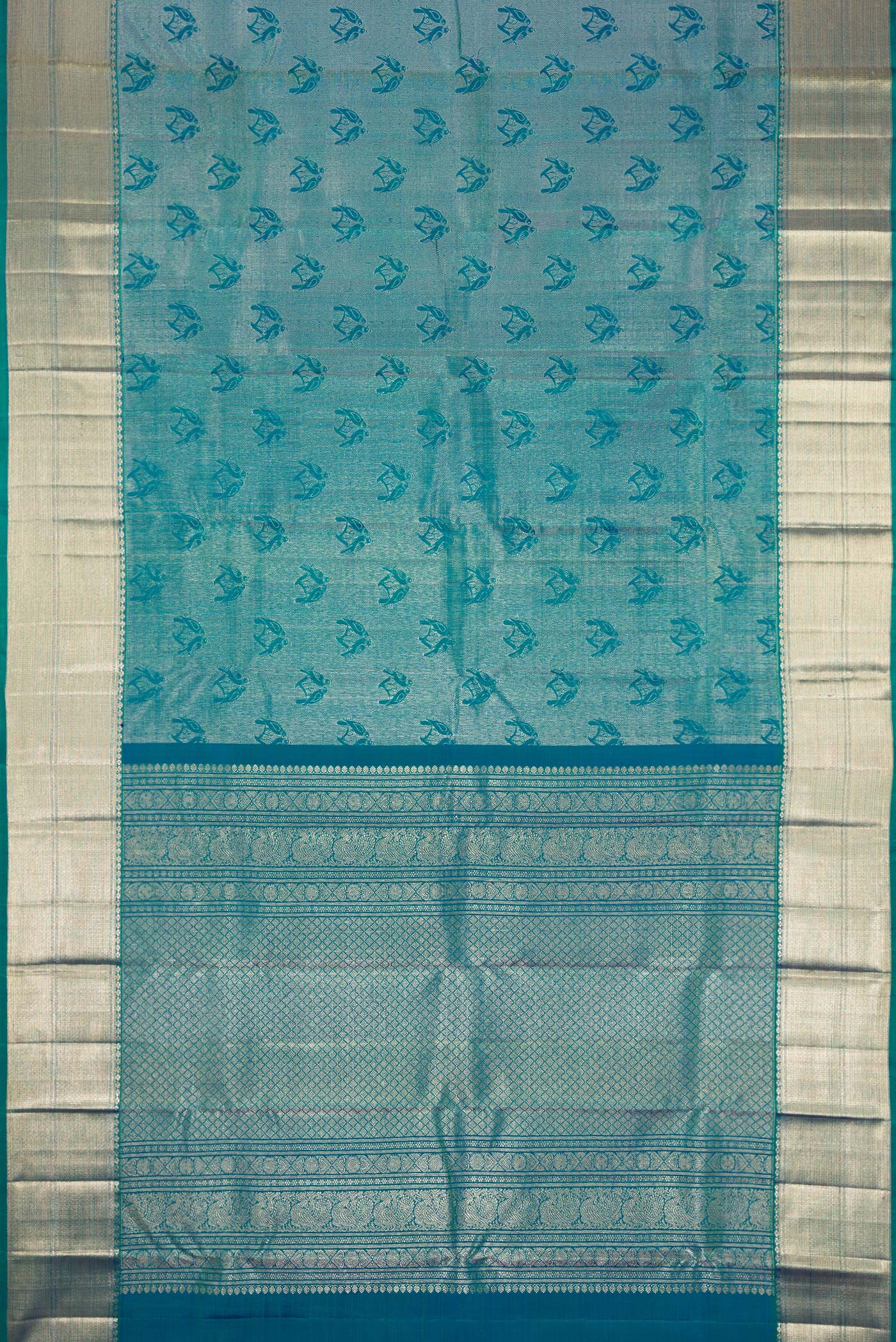 Flat view of Peacock Blue Dual Tone Kanchipuram Silk Saree with Zari Brocade on the body and Zari Border. 