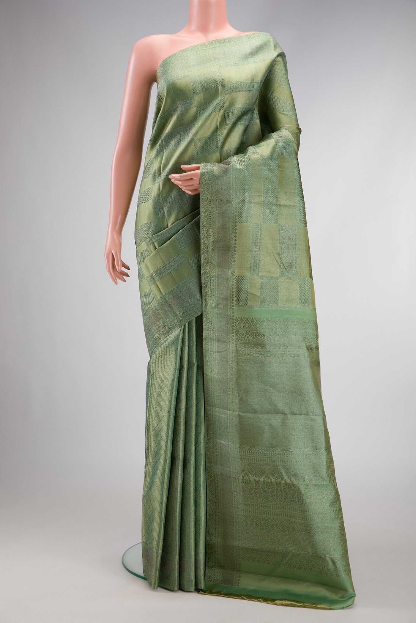 Mehandi Green Dual Tone Kanjivaram Silk Saree with Zari Brocade on the body and Zari Border.  displayed on a mannequin
