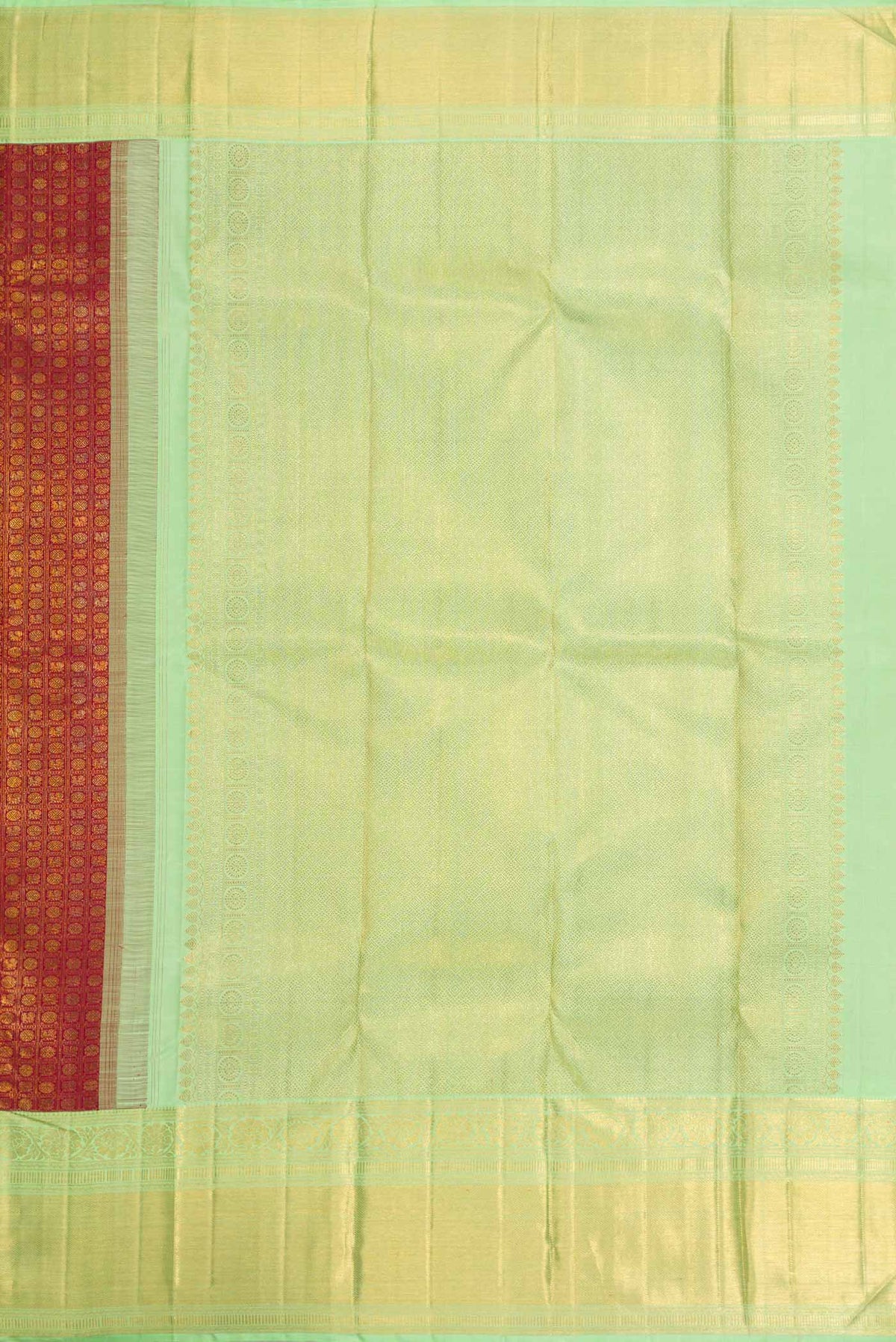 Close up image of the pallu of Maroon Dual Tone Kanchipuram Silk Saree with Zari Brocade on the body and Zari Border